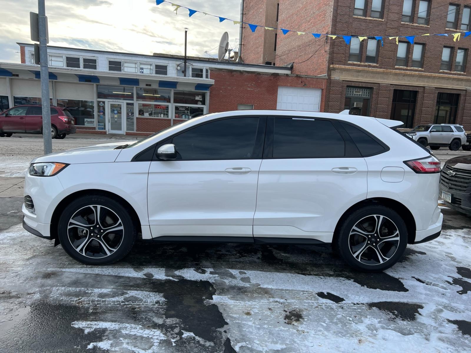 2019 WHITE /Black Ford Edge Sport AWD (2FMPK4AP7KB) with an 2.7L V6 DOCH 24V engine, 6A transmission, located at 116 5th Avenue South, Lewistown, MT, 59457, 47.063877, -109.427879 - Experience the perfect blend of power and luxury with the 2019 Ford Edge ST AWD. With a 2.7L engine and low miles, this vehicle will take you on a thrilling ride every time. The added convenience of a sunroof and a clean one-owner CarFax report make this SUV a must-have. Don't miss out on this incre - Photo #1