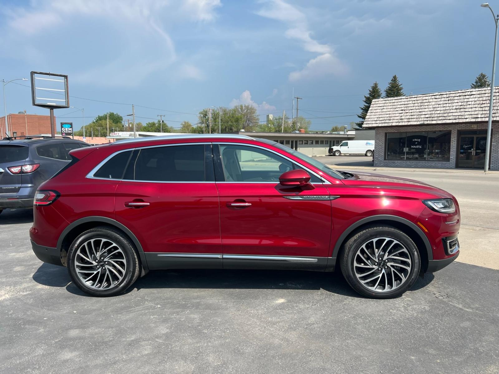 2019 Maroon /Cream Lincoln Nautilus Reserve AWD (2LMPJ8LP8KB) with an 2.7L V6 DOHC 24V engine, 6A transmission, located at 116 5th Avenue South, Lewistown, MT, 59457, 47.063877, -109.427879 - Looking for a luxurious and reliable SUV? Look no further! We present to you a stunning 2019 Lincoln Nautilus Reserve with incredibly low miles. This exceptional vehicle is a testament to Lincoln's commitment to craftsmanship and style. Don't miss out on this incredible opportunity to own a premium - Photo #0