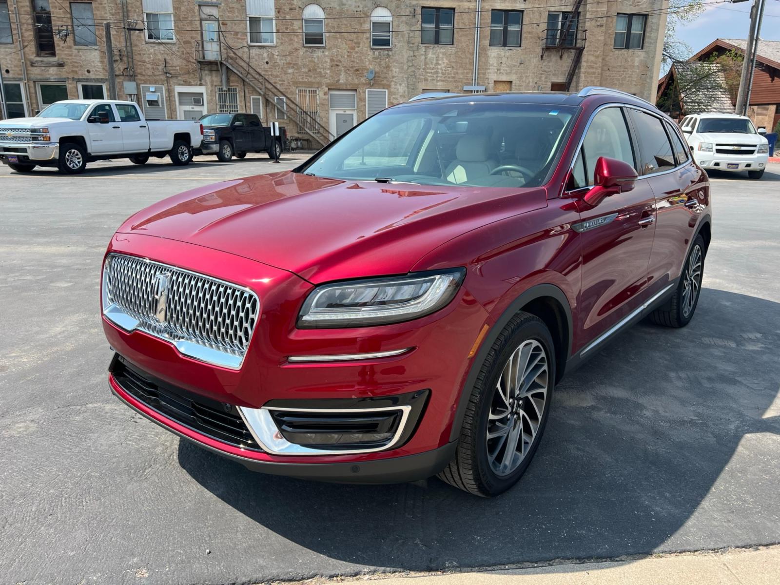 2019 Maroon /Cream Lincoln Nautilus Reserve AWD (2LMPJ8LP8KB) with an 2.7L V6 DOHC 24V engine, 6A transmission, located at 116 5th Avenue South, Lewistown, MT, 59457, 47.063877, -109.427879 - Looking for a luxurious and reliable SUV? Look no further! We present to you a stunning 2019 Lincoln Nautilus Reserve with incredibly low miles. This exceptional vehicle is a testament to Lincoln's commitment to craftsmanship and style. Don't miss out on this incredible opportunity to own a premium - Photo #3