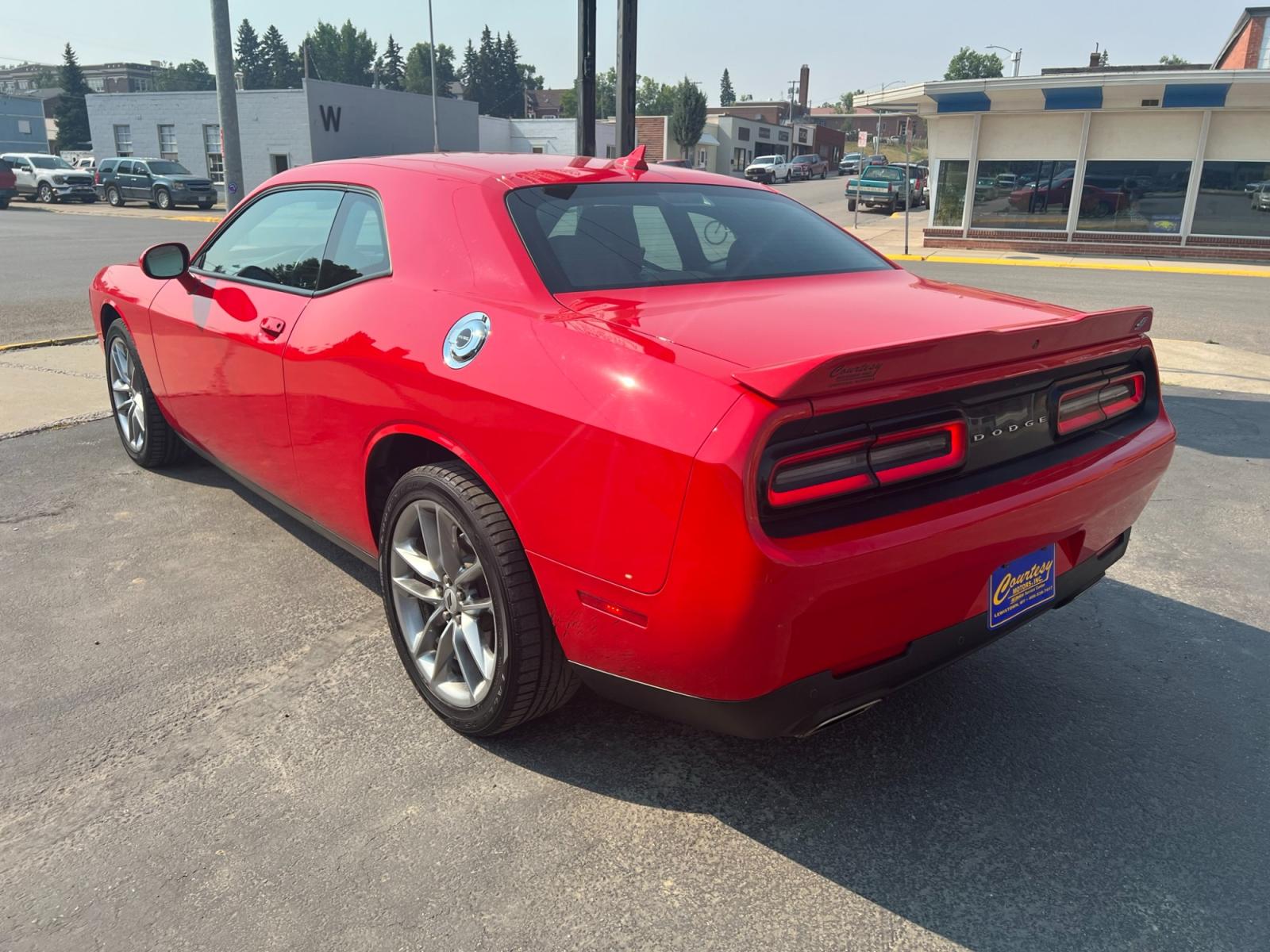 2021 Red /Black Dodge Challenger GT AWD (2C3CDZKG1MH) with an 3.6L V6 DOHC 24V engine, 8A transmission, located at 116 5th Avenue South, Lewistown, MT, 59457, 47.063877, -109.427879 - Experience pure driving excitement with the 2021 Dodge Challenger GT AWD. Dominate the road with its fierce V6 engine, delivering an exhilarating performance that will leave you breathless. Feel the rush as you seamlessly grip the pavement with the advanced all-wheel-drive system, ensuring control a - Photo #2