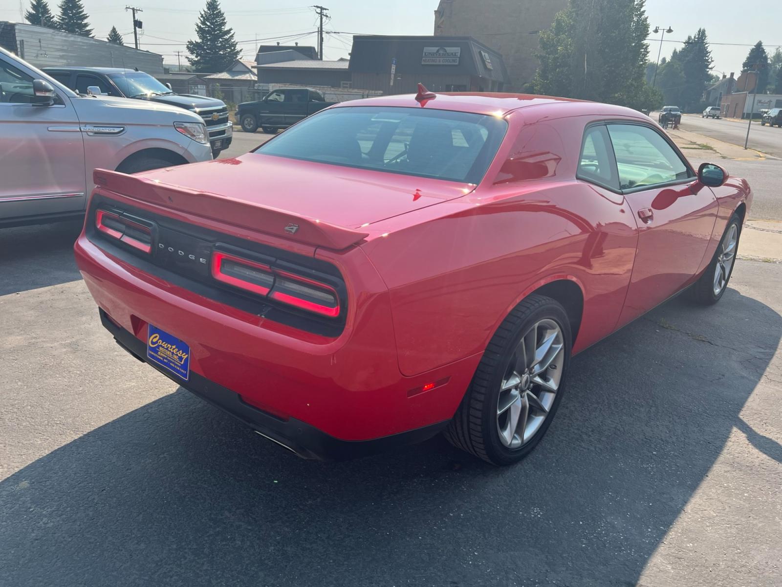 2021 Red /Black Dodge Challenger GT AWD (2C3CDZKG1MH) with an 3.6L V6 DOHC 24V engine, 8A transmission, located at 116 5th Avenue South, Lewistown, MT, 59457, 47.063877, -109.427879 - Experience pure driving excitement with the 2021 Dodge Challenger GT AWD. Dominate the road with its fierce V6 engine, delivering an exhilarating performance that will leave you breathless. Feel the rush as you seamlessly grip the pavement with the advanced all-wheel-drive system, ensuring control a - Photo #4
