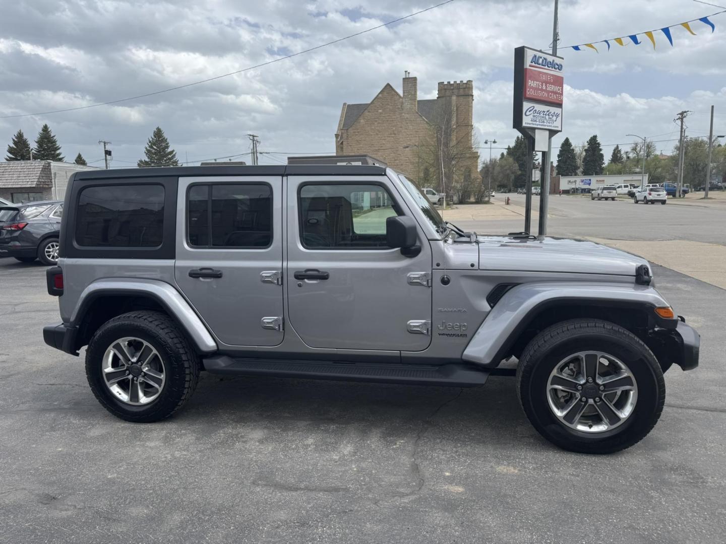 2021 Silver /Charcoal Jeep Wrangler Unlimited Sahara (1C4HJXEN3MW) with an 2.0L L4 DOHC 16V TURBO engine, 8A transmission, located at 116 5th Avenue South, Lewistown, MT, 59457, 47.063877, -109.427879 - Available now: 2021 Jeep Wrangler Sahara — a perfect blend of rugged capability and refined comfort. Powered by Jeep’s 2.0L Turbocharged engine, this two-door SUV delivers impressive torque and efficiency while maintaining the legendary off-road performance Jeep is known for. The Sahara trim add - Photo#1