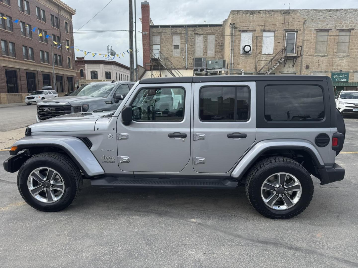 2021 Silver /Charcoal Jeep Wrangler Unlimited Sahara (1C4HJXEN3MW) with an 2.0L L4 DOHC 16V TURBO engine, 8A transmission, located at 116 5th Avenue South, Lewistown, MT, 59457, 47.063877, -109.427879 - Available now: 2021 Jeep Wrangler Sahara — a perfect blend of rugged capability and refined comfort. Powered by Jeep’s 2.0L Turbocharged engine, this two-door SUV delivers impressive torque and efficiency while maintaining the legendary off-road performance Jeep is known for. The Sahara trim add - Photo#5