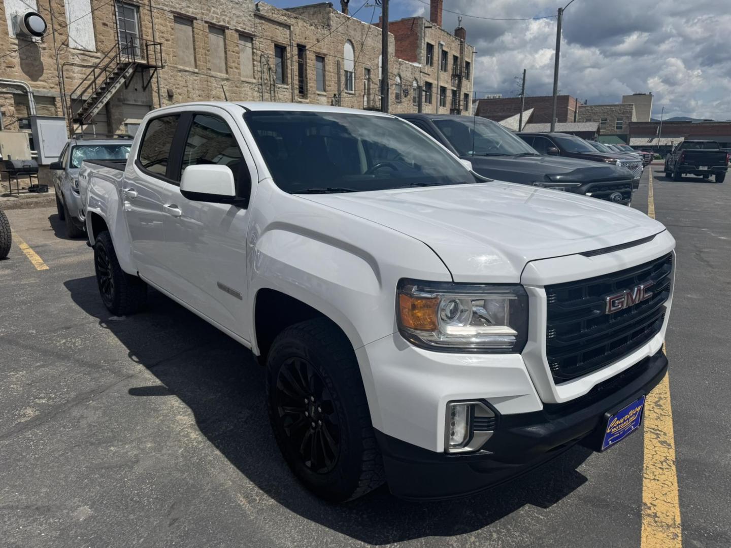 2021 WHITE /Black GMC Canyon Elevation Crew Cab 4WD (1GTG6CEN1M1) with an 3.6L V6 DOHC 24V engine, 6A transmission, located at 116 5th Avenue South, Lewistown, MT, 59457, 47.063877, -109.427879 - Stand out on the road and off it with this sharp 2021 GMC Canyon Elevation. This midsize truck brings rugged capability, modern tech, and head-turning style in a versatile package perfect for work or play. Powered by a responsive engine and equipped with 4WD, it’s ready for all-season traction and - Photo#0