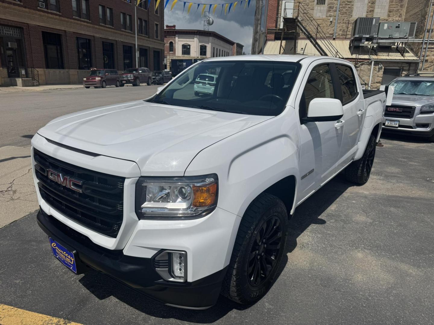 2021 WHITE /Black GMC Canyon Elevation Crew Cab 4WD (1GTG6CEN1M1) with an 3.6L V6 DOHC 24V engine, 6A transmission, located at 116 5th Avenue South, Lewistown, MT, 59457, 47.063877, -109.427879 - Stand out on the road and off it with this sharp 2021 GMC Canyon Elevation. This midsize truck brings rugged capability, modern tech, and head-turning style in a versatile package perfect for work or play. Powered by a responsive engine and equipped with 4WD, it’s ready for all-season traction and - Photo#6
