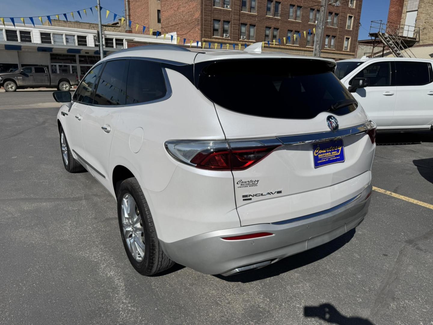 2023 WHITE /BEIGE Buick Enclave Essence AWD (5GAEVAKW1PJ) with an 3.6L V6 DOHC 24V engine, 9A transmission, located at 116 5th Avenue South, Lewistown, MT, 59457, 47.063877, -109.427879 - 2023 Buick Enclave Essence AWD – Rare Tan Leather – Low Miles, High Comfort This 2023 Buick Enclave Essence AWD is the perfect blend of style, space, and smooth performance — and it comes with one of the most sought-after interior options: beautiful, hard-to-find tan leather. If you’re look - Photo#4