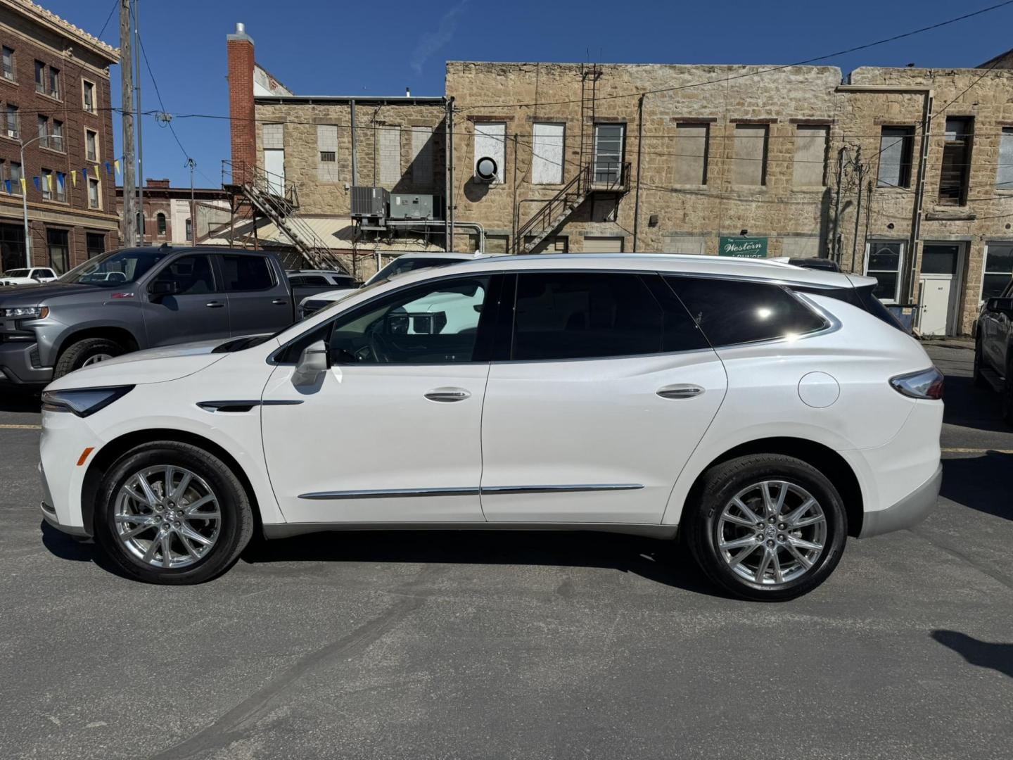 2023 WHITE /BEIGE Buick Enclave Essence AWD (5GAEVAKW1PJ) with an 3.6L V6 DOHC 24V engine, 9A transmission, located at 116 5th Avenue South, Lewistown, MT, 59457, 47.063877, -109.427879 - 2023 Buick Enclave Essence AWD – Rare Tan Leather – Low Miles, High Comfort This 2023 Buick Enclave Essence AWD is the perfect blend of style, space, and smooth performance — and it comes with one of the most sought-after interior options: beautiful, hard-to-find tan leather. If you’re look - Photo#5