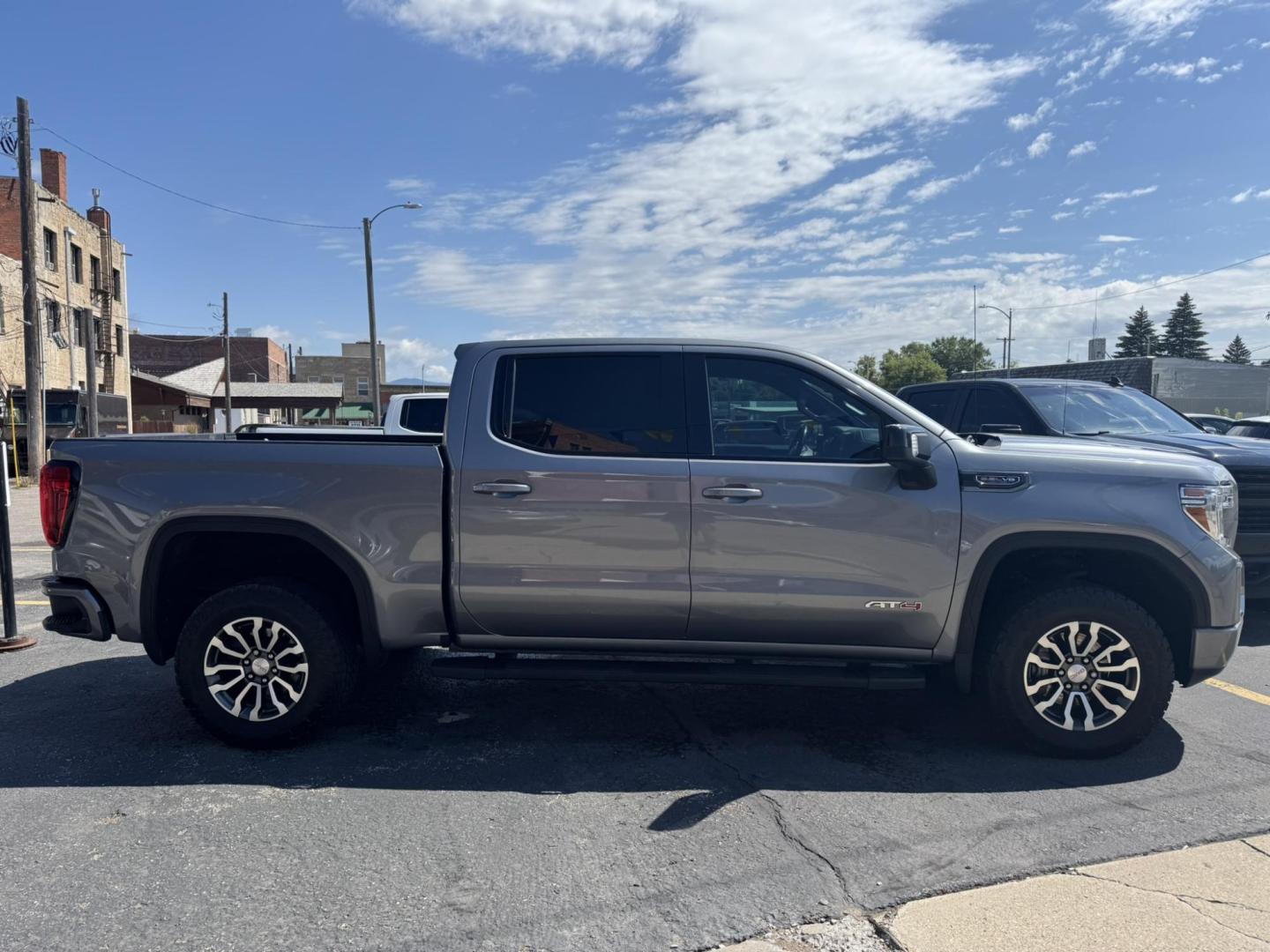 2021 Grey /Black/Brown GMC Sierra 1500 AT4 Crew Cab Short Box 4WD (1GTP9EEL8MZ) with an 6.2L V8 OHV 16V engine, 6A transmission, located at 116 5th Avenue South, Lewistown, MT, 59457, 47.063877, -109.427879 - 2021 GMC Sierra 1500 Crew Cab AT4 with the powerful 6.2L V8 and 10-speed automatic. This truck delivers 420 horsepower with a factory 2-inch lift, off-road tuned suspension, and aggressive all-terrain tires, ready for any adventure. Inside you’ll find premium leather seats, heated and ventilate - Photo#1