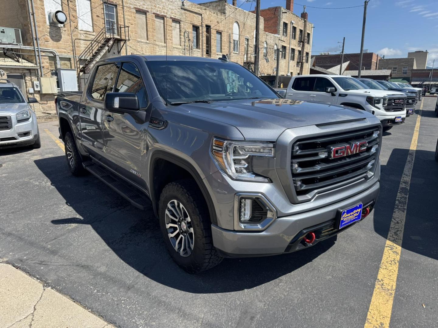 2021 Grey /Black/Brown GMC Sierra 1500 AT4 Crew Cab Short Box 4WD (1GTP9EEL8MZ) with an 6.2L V8 OHV 16V engine, 6A transmission, located at 116 5th Avenue South, Lewistown, MT, 59457, 47.063877, -109.427879 - 2021 GMC Sierra 1500 Crew Cab AT4 with the powerful 6.2L V8 and 10-speed automatic. This truck delivers 420 horsepower with a factory 2-inch lift, off-road tuned suspension, and aggressive all-terrain tires, ready for any adventure. Inside you’ll find premium leather seats, heated and ventilate - Photo#0