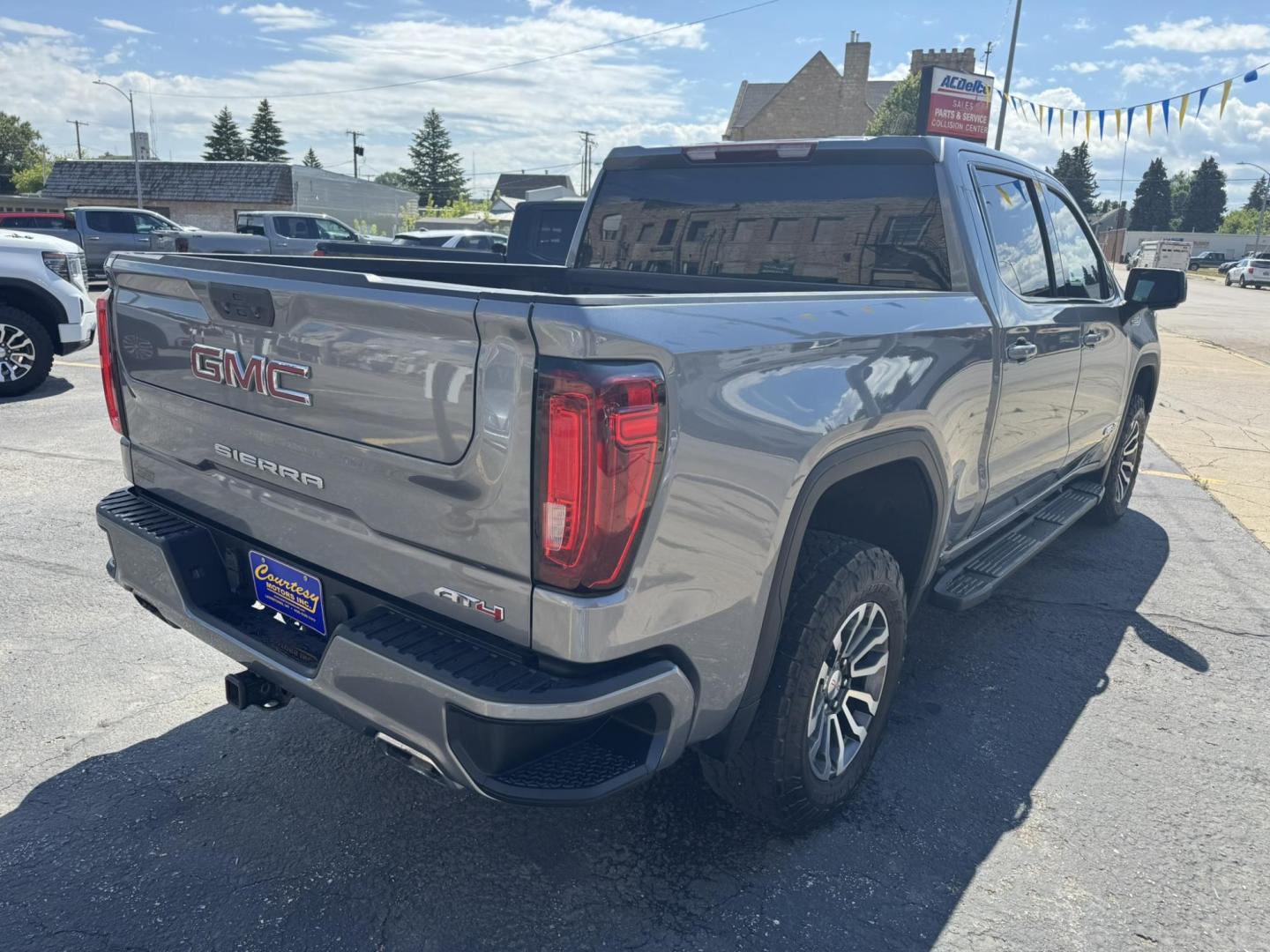 2021 Grey /Black/Brown GMC Sierra 1500 AT4 Crew Cab Short Box 4WD (1GTP9EEL8MZ) with an 6.2L V8 OHV 16V engine, 6A transmission, located at 116 5th Avenue South, Lewistown, MT, 59457, 47.063877, -109.427879 - 2021 GMC Sierra 1500 Crew Cab AT4 with the powerful 6.2L V8 and 10-speed automatic. This truck delivers 420 horsepower with a factory 2-inch lift, off-road tuned suspension, and aggressive all-terrain tires, ready for any adventure. Inside you’ll find premium leather seats, heated and ventilate - Photo#2