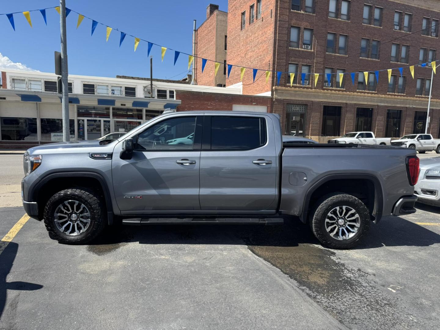 2021 Grey /Black/Brown GMC Sierra 1500 AT4 Crew Cab Short Box 4WD (1GTP9EEL8MZ) with an 6.2L V8 OHV 16V engine, 6A transmission, located at 116 5th Avenue South, Lewistown, MT, 59457, 47.063877, -109.427879 - 2021 GMC Sierra 1500 Crew Cab AT4 with the powerful 6.2L V8 and 10-speed automatic. This truck delivers 420 horsepower with a factory 2-inch lift, off-road tuned suspension, and aggressive all-terrain tires, ready for any adventure. Inside you’ll find premium leather seats, heated and ventilate - Photo#5