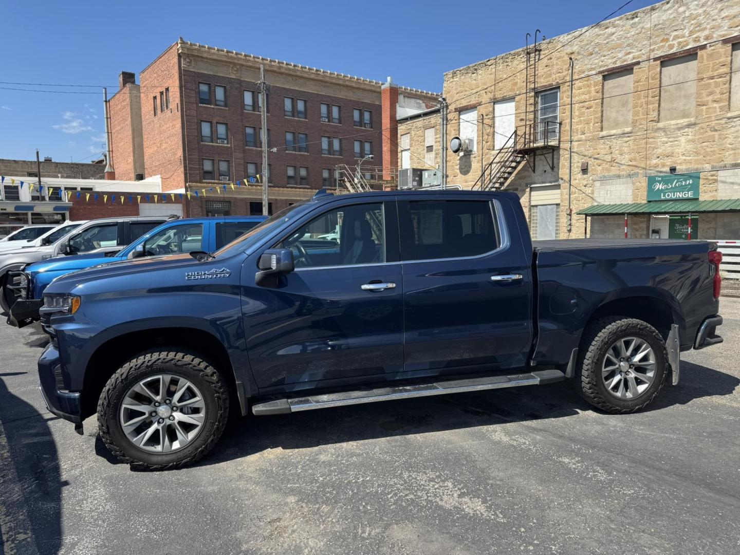 2020 Blue /Black Chevrolet Silverado 1500 High Country Crew Cab Long Box 4WD (1GCUYHELXLZ) with an 6.2L V8 OHV 16V engine, 6A transmission, located at 116 5th Avenue South, Lewistown, MT, 59457, 47.063877, -109.427879 - 2020 Chevrolet Silverado 1500 Crew Cab High Country, the perfect blend of premium comfort and powerful performance. Equipped with a strong V8 engine and smooth-shifting transmission, this truck delivers plenty of muscle for towing, hauling, or everyday driving. The High Country trim surrounds you - Photo#5