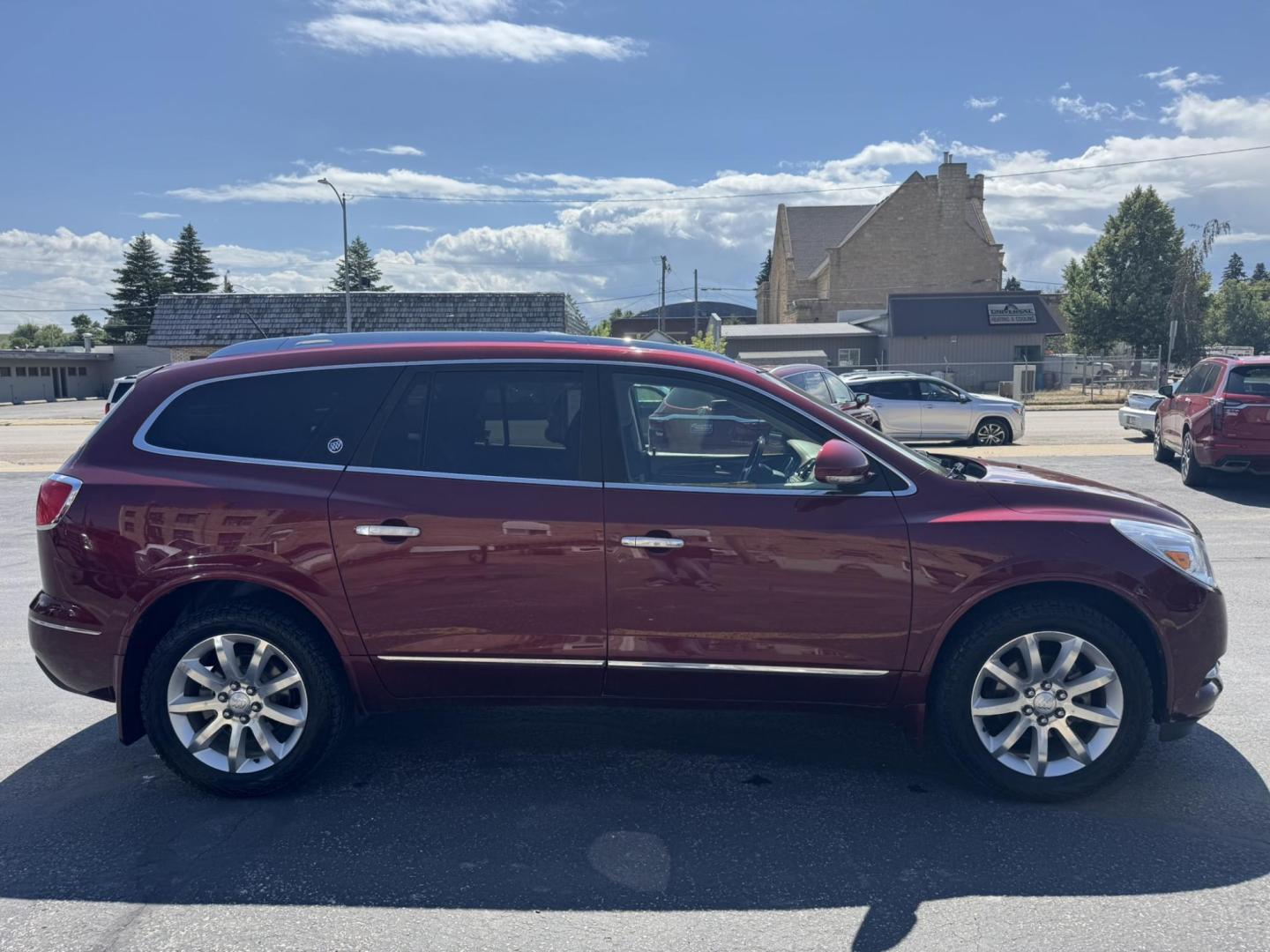 2015 Maroon /BEIGE Buick Enclave Premium AWD (5GAKVCKD9FJ) with an 3.6L V6 DOHC 24V engine, 6-Speed Automatic Overdrive transmission, located at 116 5th Avenue South, Lewistown, MT, 59457, 47.063877, -109.427879 - Looking for a 3rd row SUV that rides like a luxury sedan? This 2015 Buick Enclave Premium AWD delivers quiet comfort, smooth power, and plenty of space for the whole family. Premium trim means it’s loaded with features—heated and cooled leather seats, Bose audio, power liftgate, remote start, an - Photo#1