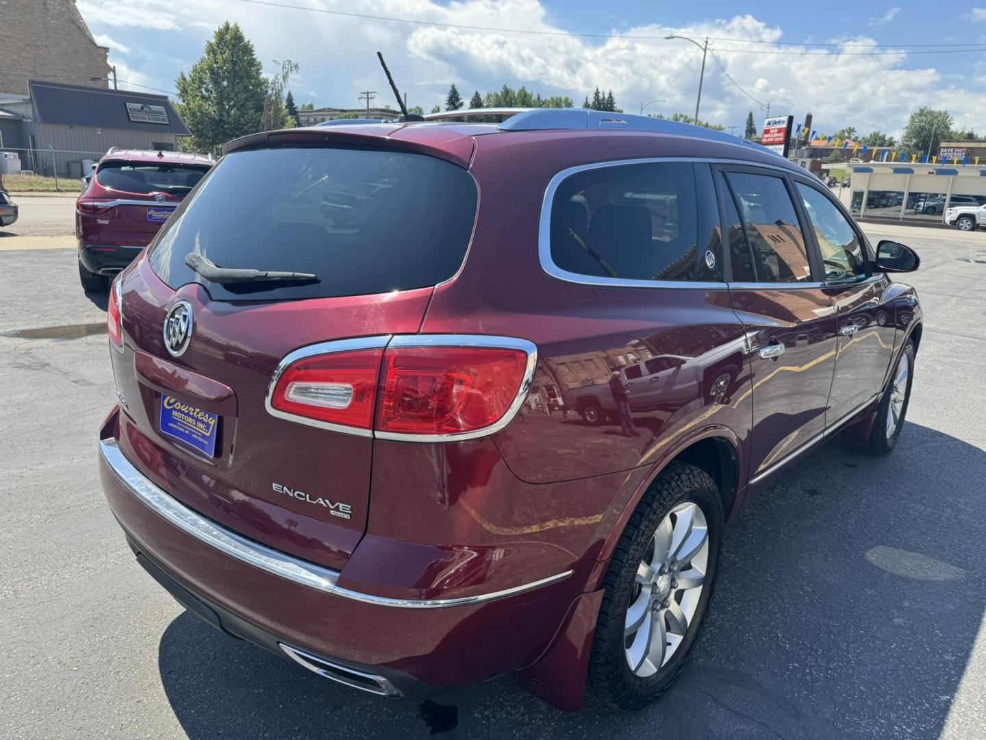 2015 Maroon /BEIGE Buick Enclave Premium AWD (5GAKVCKD9FJ) with an 3.6L V6 DOHC 24V engine, 6-Speed Automatic Overdrive transmission, located at 116 5th Avenue South, Lewistown, MT, 59457, 47.063877, -109.427879 - Looking for a 3rd row SUV that rides like a luxury sedan? This 2015 Buick Enclave Premium AWD delivers quiet comfort, smooth power, and plenty of space for the whole family. Premium trim means it’s loaded with features—heated and cooled leather seats, Bose audio, power liftgate, remote start, an - Photo#2