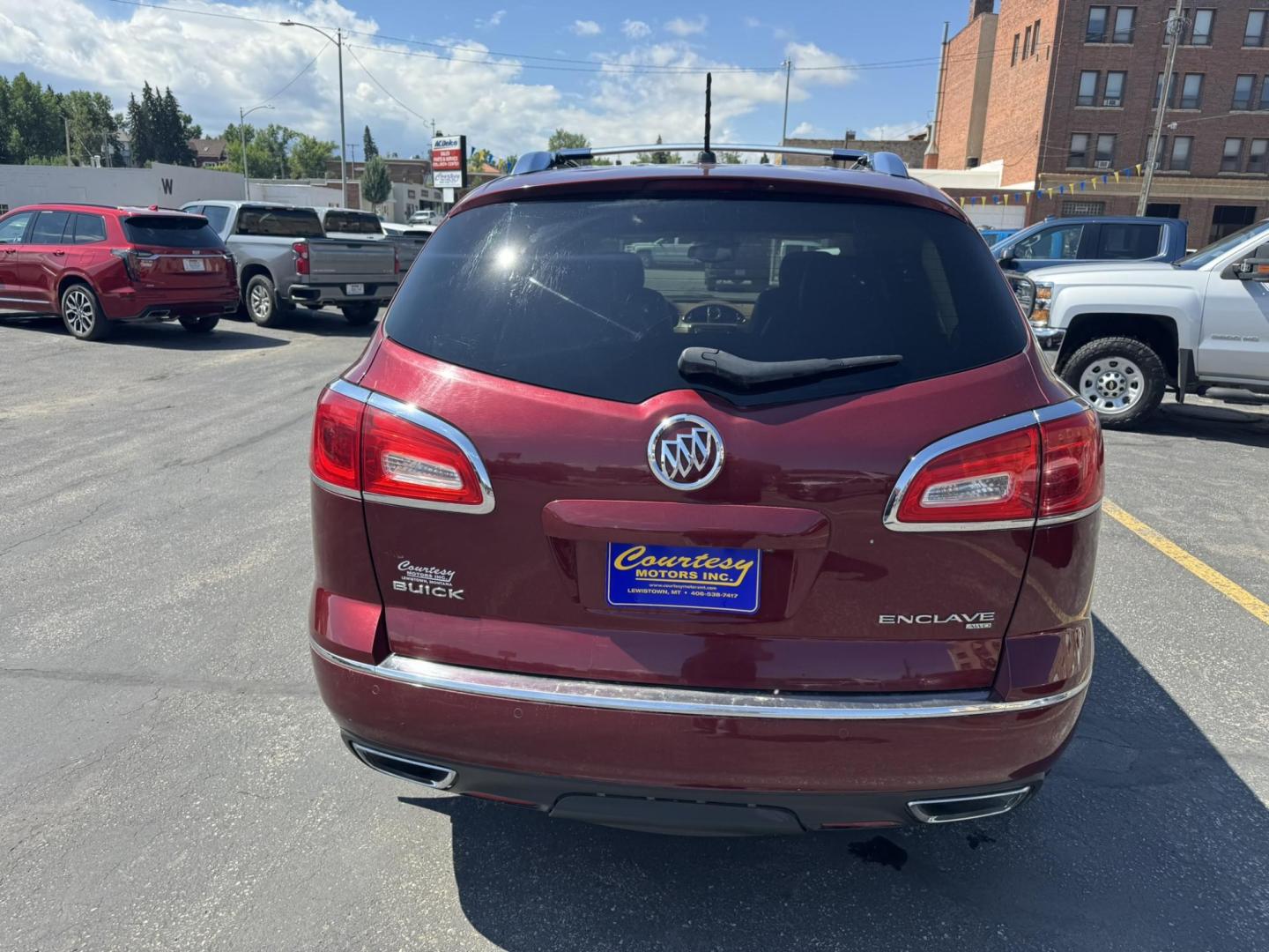 2015 Maroon /BEIGE Buick Enclave Premium AWD (5GAKVCKD9FJ) with an 3.6L V6 DOHC 24V engine, 6-Speed Automatic Overdrive transmission, located at 116 5th Avenue South, Lewistown, MT, 59457, 47.063877, -109.427879 - Looking for a 3rd row SUV that rides like a luxury sedan? This 2015 Buick Enclave Premium AWD delivers quiet comfort, smooth power, and plenty of space for the whole family. Premium trim means it’s loaded with features—heated and cooled leather seats, Bose audio, power liftgate, remote start, an - Photo#3