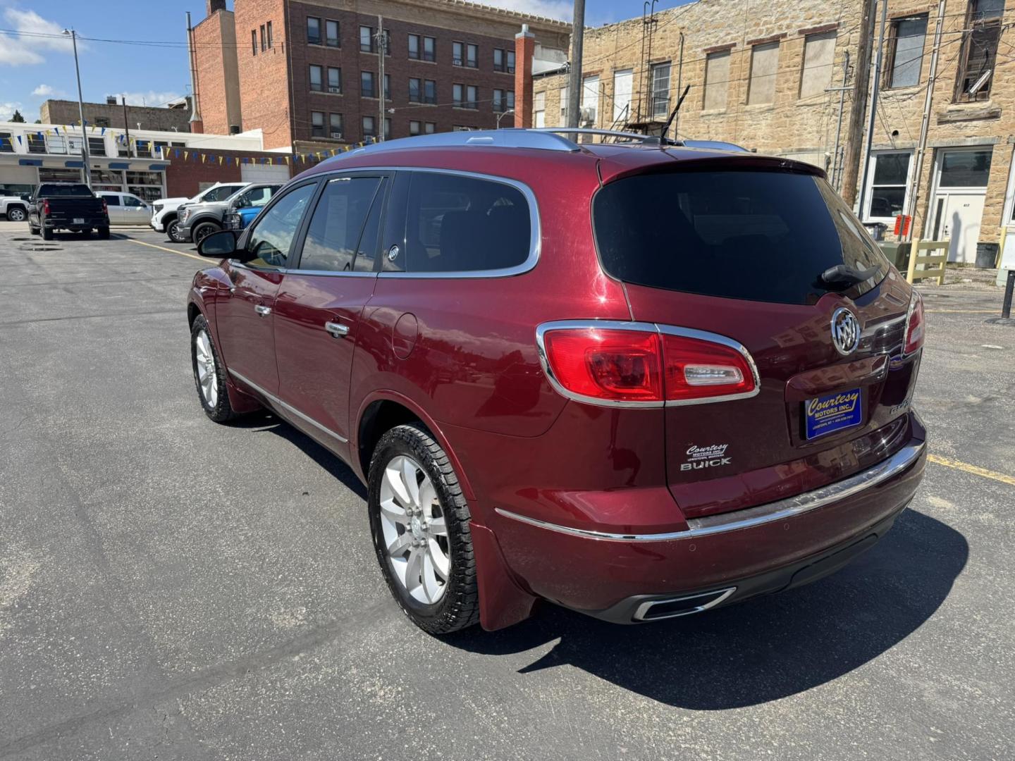 2015 Maroon /BEIGE Buick Enclave Premium AWD (5GAKVCKD9FJ) with an 3.6L V6 DOHC 24V engine, 6-Speed Automatic Overdrive transmission, located at 116 5th Avenue South, Lewistown, MT, 59457, 47.063877, -109.427879 - Looking for a 3rd row SUV that rides like a luxury sedan? This 2015 Buick Enclave Premium AWD delivers quiet comfort, smooth power, and plenty of space for the whole family. Premium trim means it’s loaded with features—heated and cooled leather seats, Bose audio, power liftgate, remote start, an - Photo#4