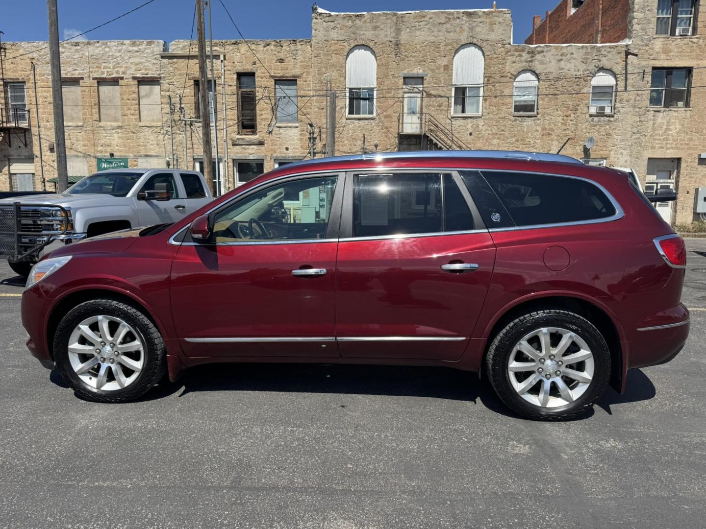 2015 Maroon /BEIGE Buick Enclave Premium AWD (5GAKVCKD9FJ) with an 3.6L V6 DOHC 24V engine, 6-Speed Automatic Overdrive transmission, located at 116 5th Avenue South, Lewistown, MT, 59457, 47.063877, -109.427879 - Looking for a 3rd row SUV that rides like a luxury sedan? This 2015 Buick Enclave Premium AWD delivers quiet comfort, smooth power, and plenty of space for the whole family. Premium trim means it’s loaded with features—heated and cooled leather seats, Bose audio, power liftgate, remote start, an - Photo#5