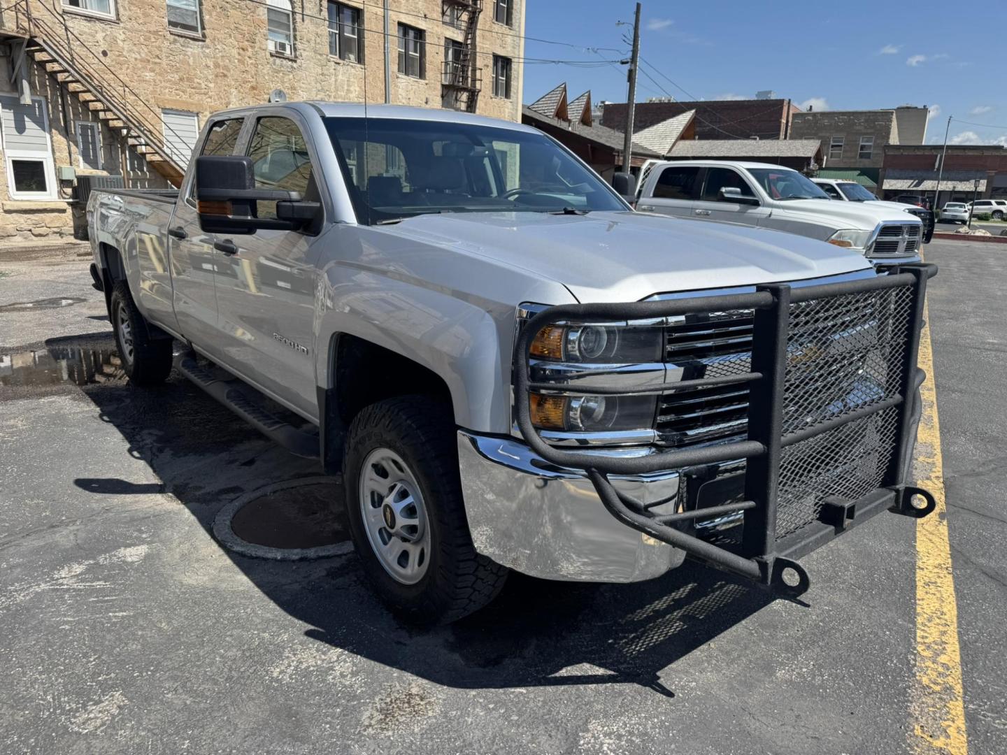 2018 Silver /Grey Chevrolet Silverado 3500HD Work Truck Double Cab Long Box 4WD (1GC2KYEG4JZ) with an 6.0L V8 OHV 16V FFV engine, 6A transmission, located at 116 5th Avenue South, Lewistown, MT, 59457, 47.063877, -109.427879 - If you need serious muscle, this 2018 Chevy Silverado 3500 HD 4x4 Work Truck is built to get the job done. Powered by a proven 6.0L V8 and paired with a heavy-duty 6-speed automatic, this long box double cab hauls, tows, and handles business without breaking a sweat. 4WD gives you confident tractio - Photo#0