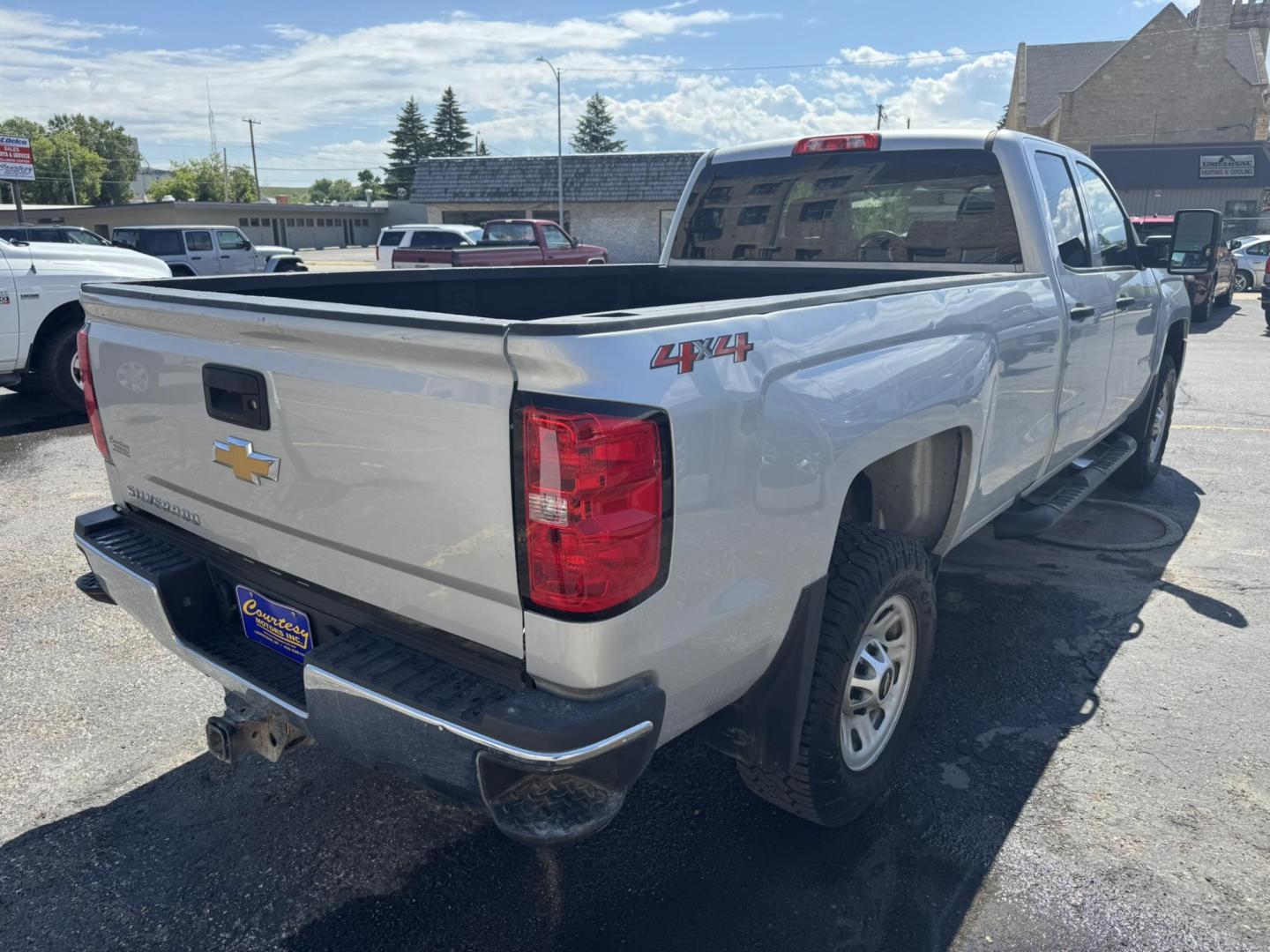 2018 Silver /Grey Chevrolet Silverado 3500HD Work Truck Double Cab Long Box 4WD (1GC2KYEG4JZ) with an 6.0L V8 OHV 16V FFV engine, 6A transmission, located at 116 5th Avenue South, Lewistown, MT, 59457, 47.063877, -109.427879 - If you need serious muscle, this 2018 Chevy Silverado 3500 HD 4x4 Work Truck is built to get the job done. Powered by a proven 6.0L V8 and paired with a heavy-duty 6-speed automatic, this long box double cab hauls, tows, and handles business without breaking a sweat. 4WD gives you confident tractio - Photo#2