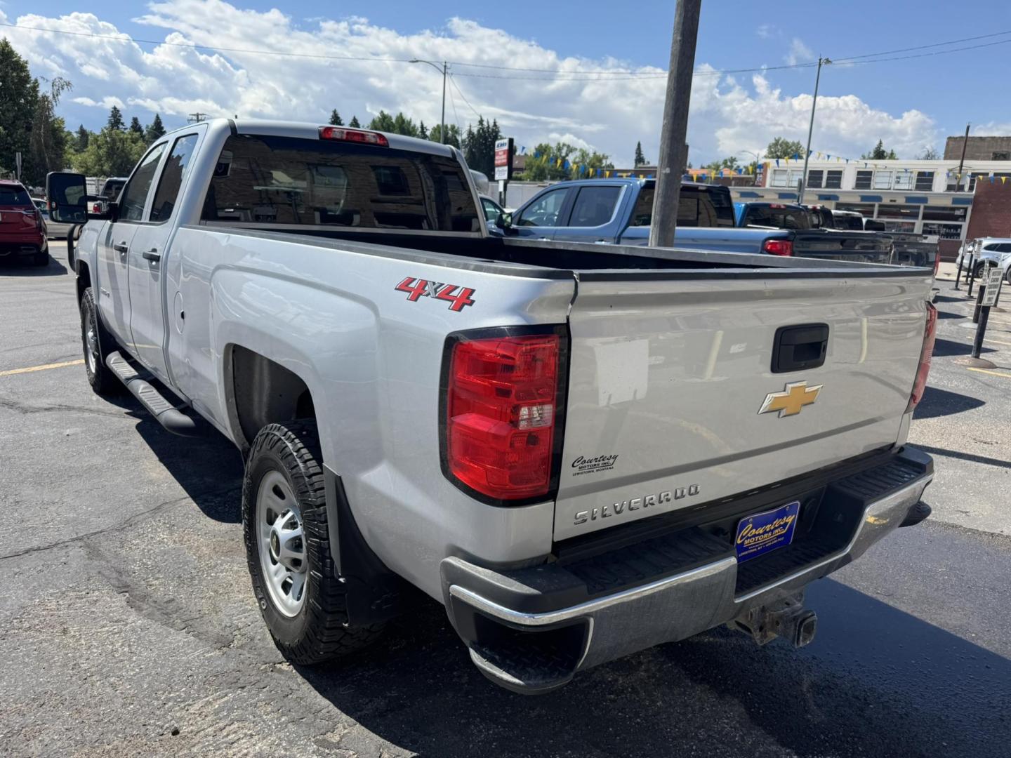 2018 Silver /Grey Chevrolet Silverado 3500HD Work Truck Double Cab Long Box 4WD (1GC2KYEG4JZ) with an 6.0L V8 OHV 16V FFV engine, 6A transmission, located at 116 5th Avenue South, Lewistown, MT, 59457, 47.063877, -109.427879 - If you need serious muscle, this 2018 Chevy Silverado 3500 HD 4x4 Work Truck is built to get the job done. Powered by a proven 6.0L V8 and paired with a heavy-duty 6-speed automatic, this long box double cab hauls, tows, and handles business without breaking a sweat. 4WD gives you confident tractio - Photo#4