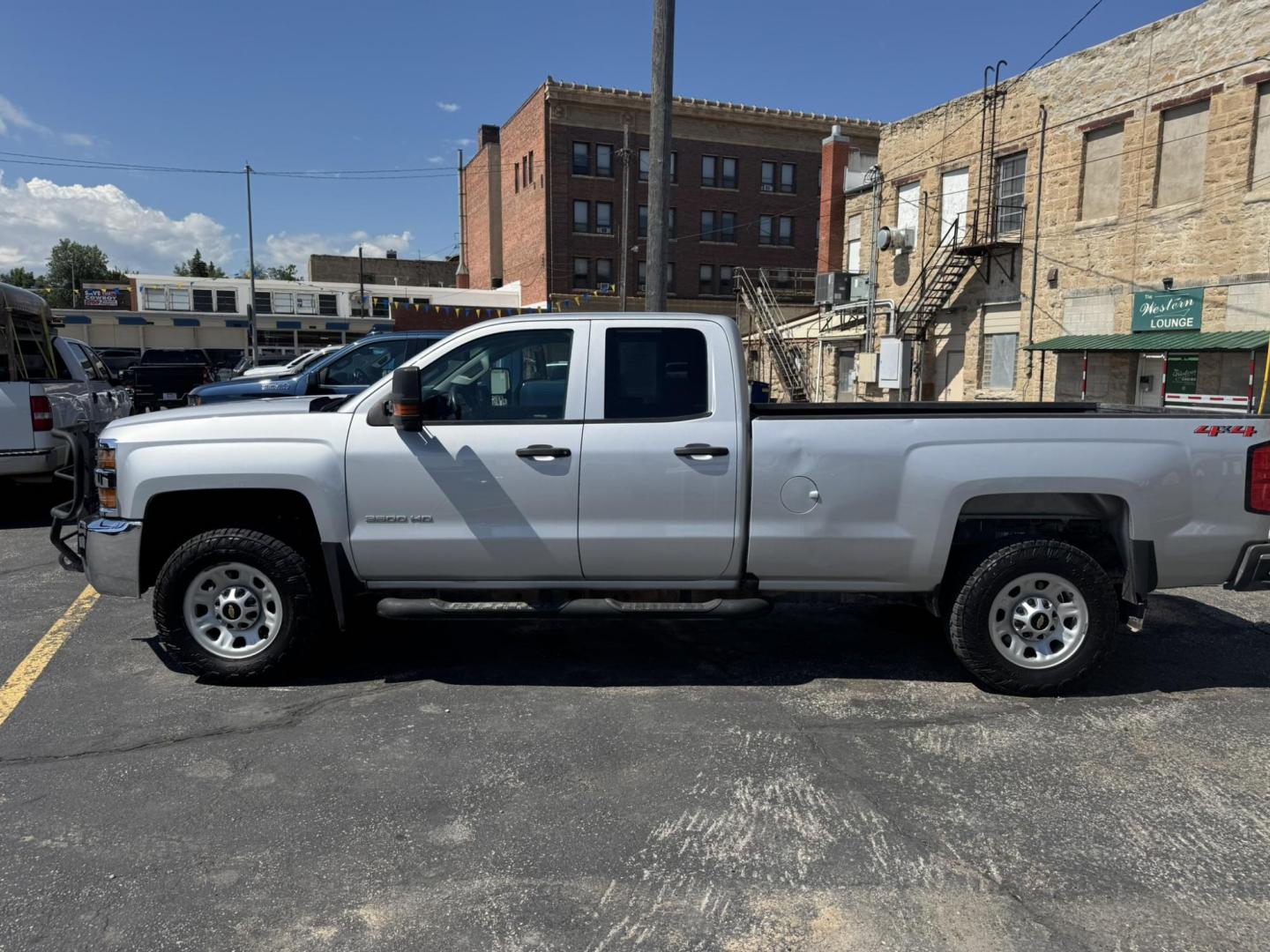 2018 Silver /Grey Chevrolet Silverado 3500HD Work Truck Double Cab Long Box 4WD (1GC2KYEG4JZ) with an 6.0L V8 OHV 16V FFV engine, 6A transmission, located at 116 5th Avenue South, Lewistown, MT, 59457, 47.063877, -109.427879 - If you need serious muscle, this 2018 Chevy Silverado 3500 HD 4x4 Work Truck is built to get the job done. Powered by a proven 6.0L V8 and paired with a heavy-duty 6-speed automatic, this long box double cab hauls, tows, and handles business without breaking a sweat. 4WD gives you confident tractio - Photo#5