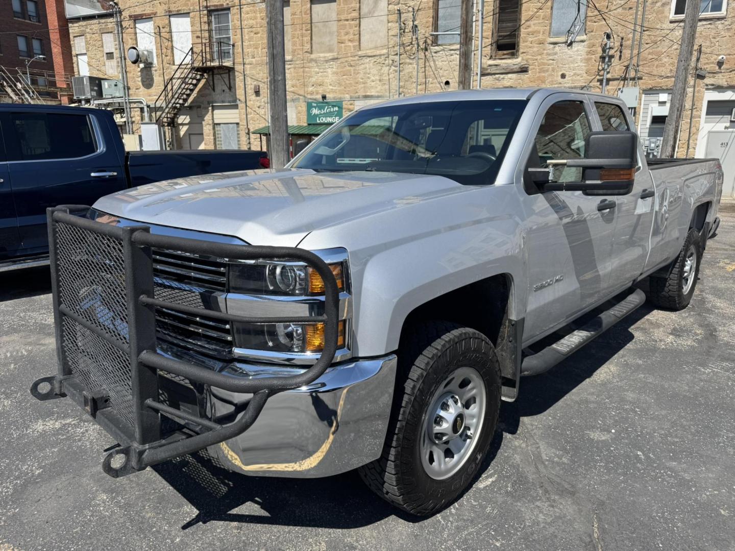 2018 Silver /Grey Chevrolet Silverado 3500HD Work Truck Double Cab Long Box 4WD (1GC2KYEG4JZ) with an 6.0L V8 OHV 16V FFV engine, 6A transmission, located at 116 5th Avenue South, Lewistown, MT, 59457, 47.063877, -109.427879 - If you need serious muscle, this 2018 Chevy Silverado 3500 HD 4x4 Work Truck is built to get the job done. Powered by a proven 6.0L V8 and paired with a heavy-duty 6-speed automatic, this long box double cab hauls, tows, and handles business without breaking a sweat. 4WD gives you confident tractio - Photo#6