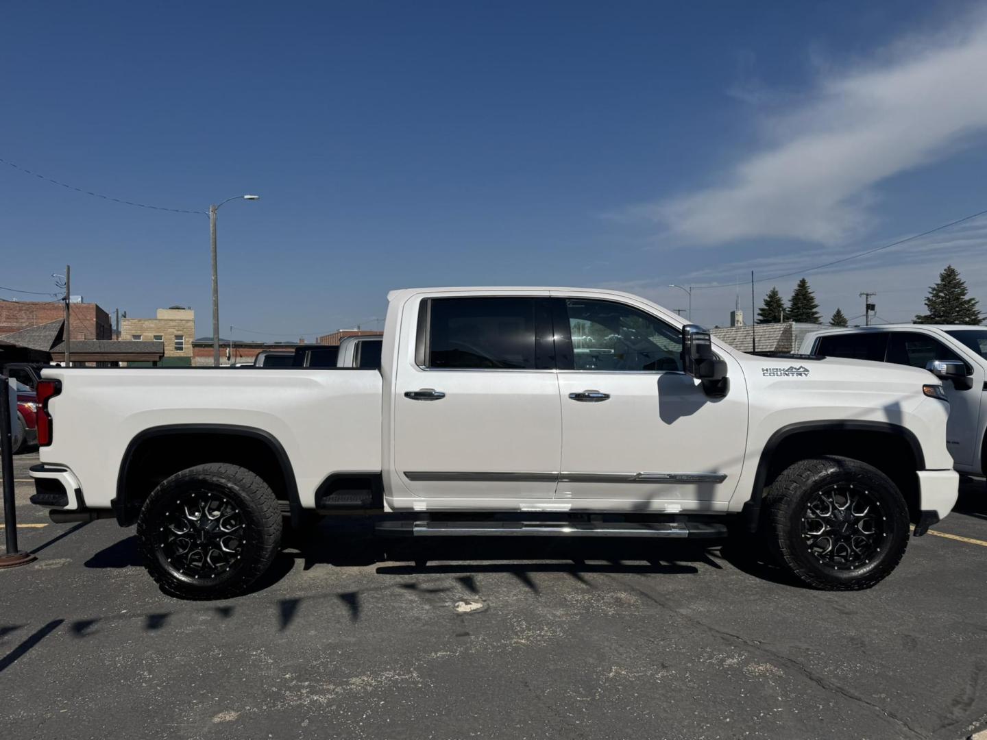 2024 WHITE /Black/Brown Chevrolet Silverado 2500HD High Country Crew Cab Short Box 4WD (1GC4YRE75RF) with an 6.6L V8 OHV 16V engine, 6A transmission, located at 116 5th Avenue South, Lewistown, MT, 59457, 47.063877, -109.427879 - Here’s the heavy-duty truck that checks every box. This 2024 Silverado 2500HD High Country gives you premium comfort and style with the capability you expect from a Chevy HD. Under the hood is the reliable 6.6L V8 gas engine paired with 4-wheel drive, built to tow, haul, and handle tough jobs with - Photo#6