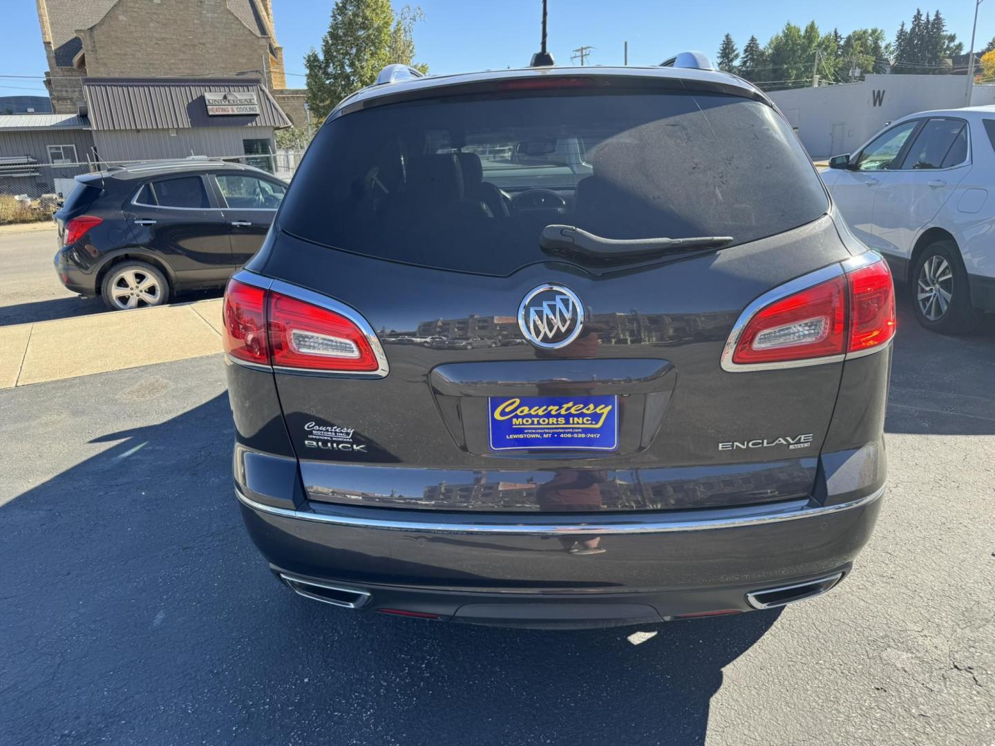 2016 Charcoal /Black Buick Enclave Premium AWD (5GAKVCKD9GJ) with an 3.6L V6 DOHC 24V engine, 6A transmission, located at 116 5th Avenue South, Lewistown, MT, 59457, 47.063877, -109.427879 - Ride in comfort and style with this 2016 Buick Enclave Premium AWD, a spacious SUV designed for families and drivers who want luxury without compromise. With its bold exterior, quiet cabin, and advanced features, the Enclave delivers the perfect balance of elegance and practicality. The Premium tri - Photo#3
