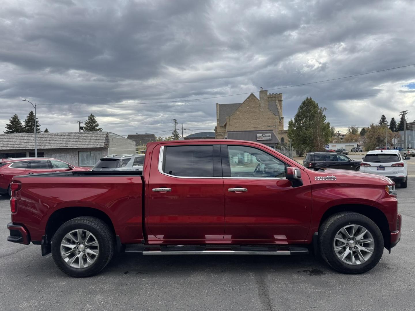 2021 Maroon /Black/Brown Chevrolet Silverado 1500 High Country Crew Cab Short Box 4WD (1GCUYHEL4MZ) with an 6.2L V8 OHV 16V engine, 6A transmission, located at 116 5th Avenue South, Lewistown, MT, 59457, 47.063877, -109.427879 - 2021 Chevrolet Silverado 1500 High Country 4WD – 6.2L Power, Clean and Loaded! Top of the line and built to impress, this 2021 Silverado High Country pairs luxury with serious muscle. Under the hood is the powerful 6.2L V8 — the most sought-after engine in the lineup — delivering strong towin - Photo#1