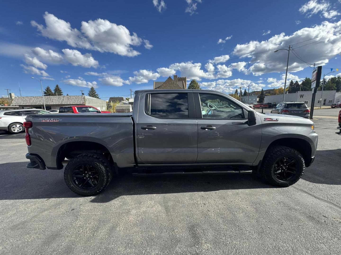 2021 Grey /Black Chevrolet Silverado 1500 Custom Trail Boss Crew Cab Short Box 4WD (1GCPYCEF8MZ) with an 5.3L V8 OHV 16V engine, 6A transmission, located at 116 5th Avenue South, Lewistown, MT, 59457, 47.063877, -109.427879 - 2021 Chevrolet Silverado 1500 Custom Trail Boss 4WD – Lifted from the Factory and Ready to Roll! Built for adventure, this 2021 Silverado Custom Trail Boss brings rugged style and off-road performance straight from the factory. Powered by a 5.3L V8 and paired with a true 4WD system, it features - Photo#1