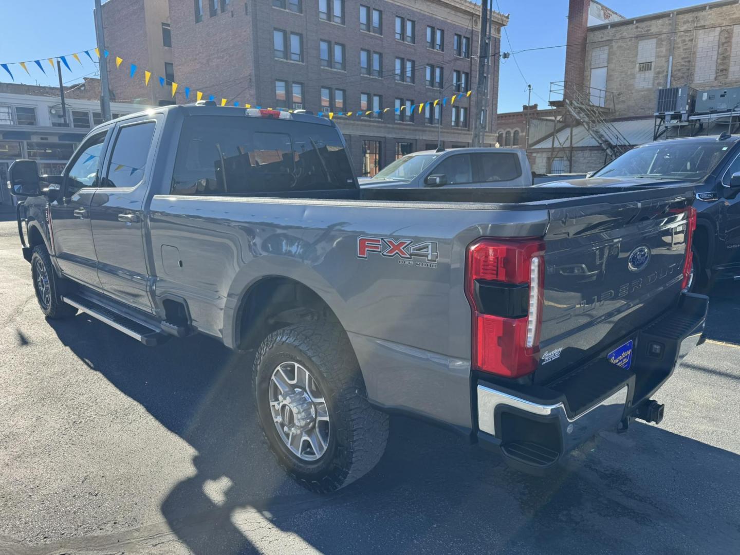2023 Grey /Black Ford F-350 SD Lariat Crew Cab Long Bed 4WD (1FT8W3BN0PE) with an 7.3L V8 OHV 16V engine, 6A transmission, located at 116 5th Avenue South, Lewistown, MT, 59457, 47.063877, -109.427879 - Photo#4