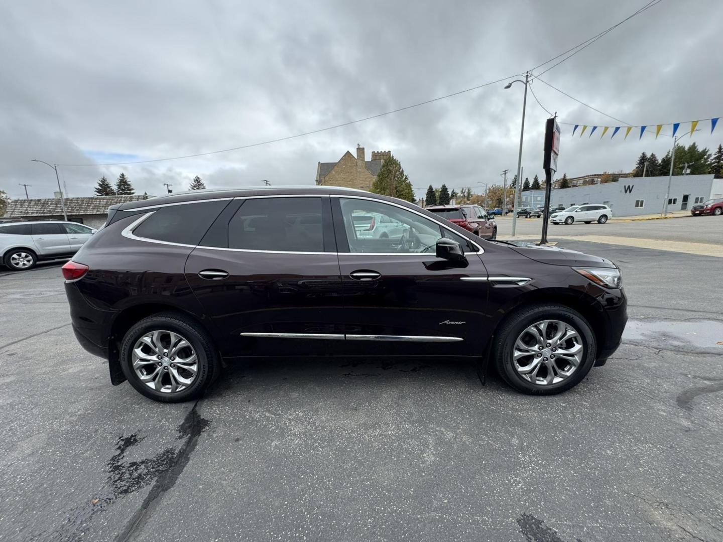 2021 Maroon /Brown Buick Enclave Avenir AWD (5GAEVCKWXMJ) with an 3.6L V6 DOHC 24V engine, 9A transmission, located at 116 5th Avenue South, Lewistown, MT, 59457, 47.063877, -109.427879 - Experience premium comfort and style in this 2021 Buick Enclave Avenir AWD — Buick’s flagship SUV that blends first-class luxury with confident performance. This one delivers everything you’d expect from the Avenir line: a beautifully refined interior with quilted leather seating, woodgrain tr - Photo#1