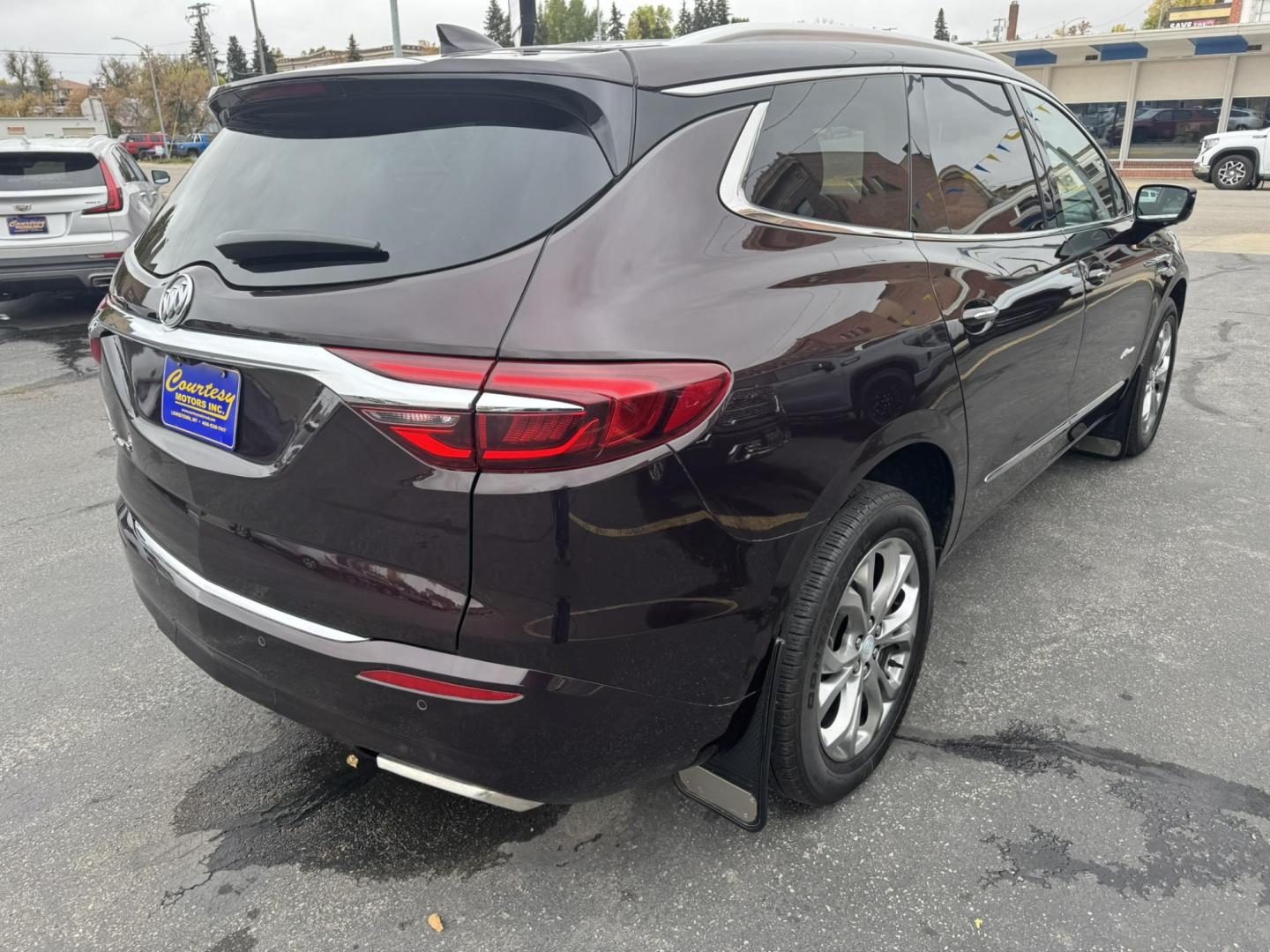 2021 Maroon /Brown Buick Enclave Avenir AWD (5GAEVCKWXMJ) with an 3.6L V6 DOHC 24V engine, 9A transmission, located at 116 5th Avenue South, Lewistown, MT, 59457, 47.063877, -109.427879 - Experience premium comfort and style in this 2021 Buick Enclave Avenir AWD — Buick’s flagship SUV that blends first-class luxury with confident performance. This one delivers everything you’d expect from the Avenir line: a beautifully refined interior with quilted leather seating, woodgrain tr - Photo#2
