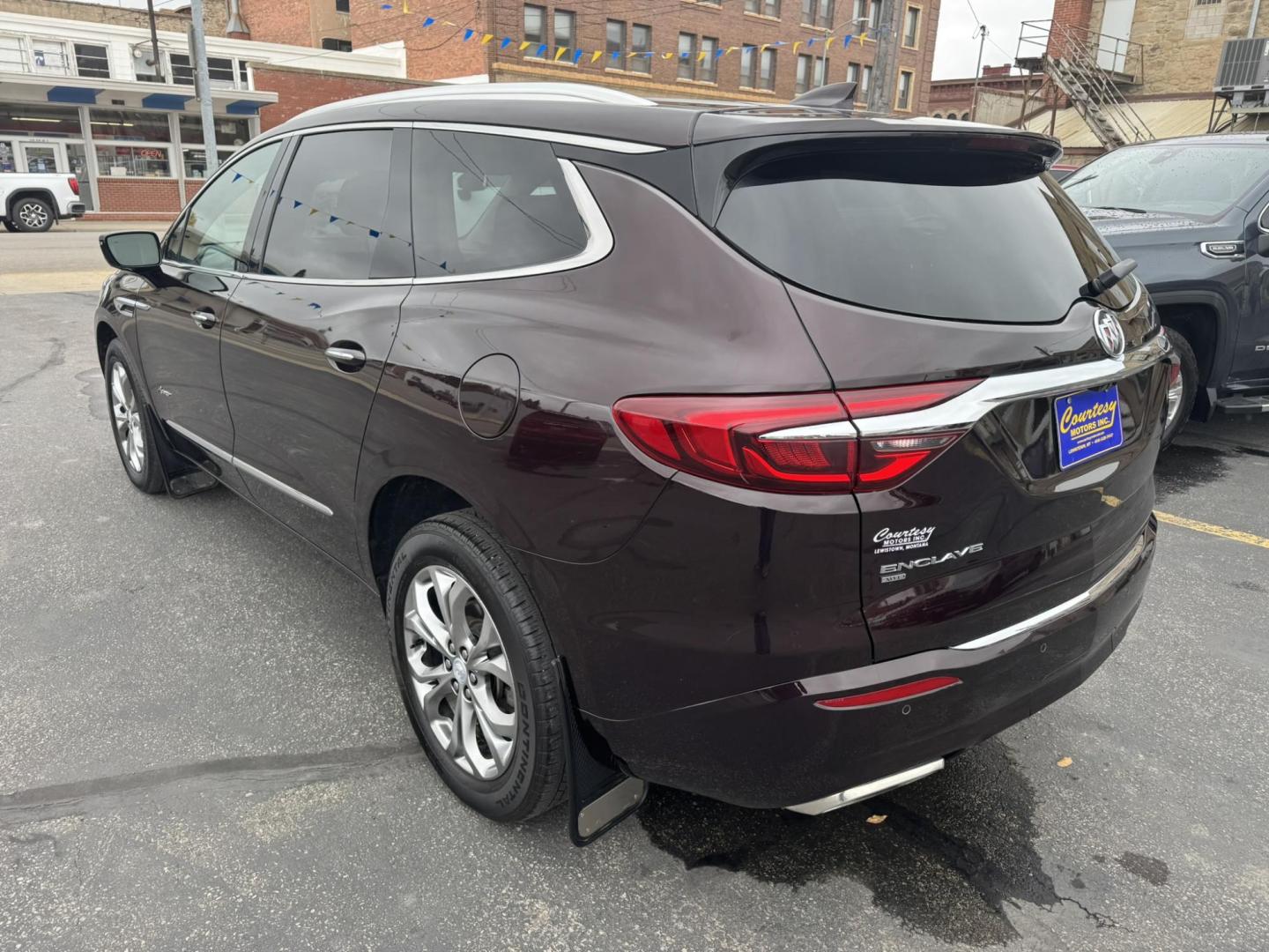 2021 Maroon /Brown Buick Enclave Avenir AWD (5GAEVCKWXMJ) with an 3.6L V6 DOHC 24V engine, 9A transmission, located at 116 5th Avenue South, Lewistown, MT, 59457, 47.063877, -109.427879 - Experience premium comfort and style in this 2021 Buick Enclave Avenir AWD — Buick’s flagship SUV that blends first-class luxury with confident performance. This one delivers everything you’d expect from the Avenir line: a beautifully refined interior with quilted leather seating, woodgrain tr - Photo#4
