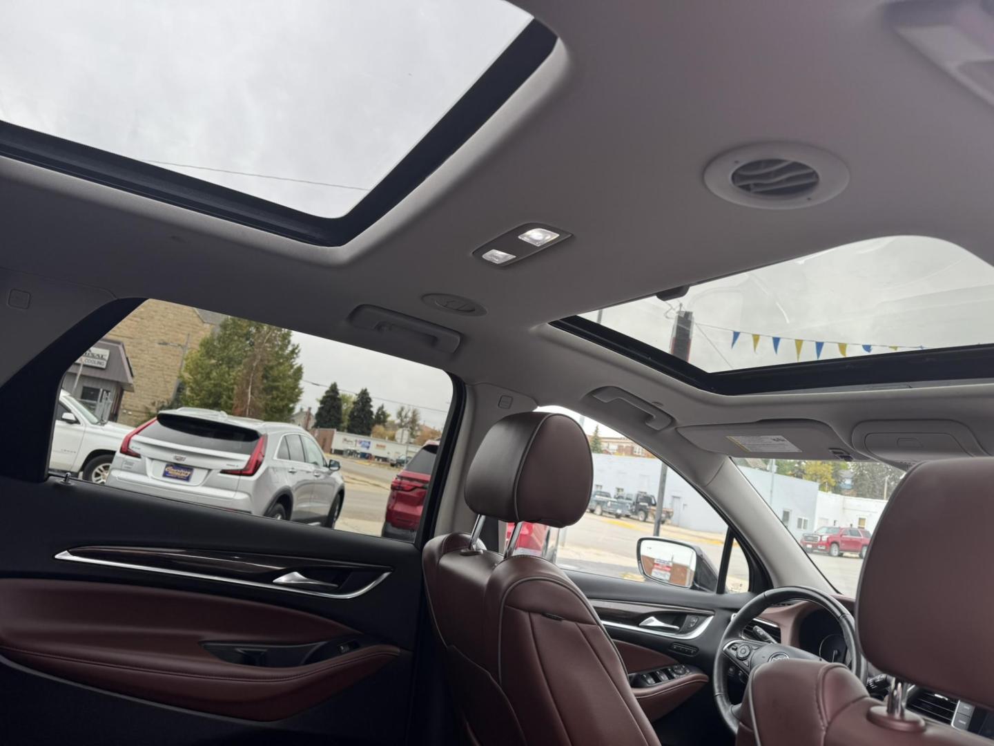 2021 Maroon /Brown Buick Enclave Avenir AWD (5GAEVCKWXMJ) with an 3.6L V6 DOHC 24V engine, 9A transmission, located at 116 5th Avenue South, Lewistown, MT, 59457, 47.063877, -109.427879 - Experience premium comfort and style in this 2021 Buick Enclave Avenir AWD — Buick’s flagship SUV that blends first-class luxury with confident performance. This one delivers everything you’d expect from the Avenir line: a beautifully refined interior with quilted leather seating, woodgrain tr - Photo#9