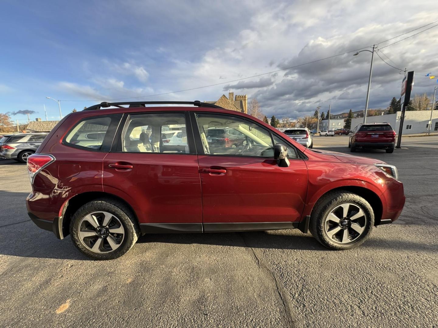 2017 Maroon /Grey Subaru Forester 2.5i Premium PZEV CVT (JF2SJABCXHH) with an 2.5L H4 SOHC 16V engine, CVT transmission, located at 116 5th Avenue South, Lewistown, MT, 59457, 47.063877, -109.427879 - Clean One Owner Car Fax, local trade! - Photo#1