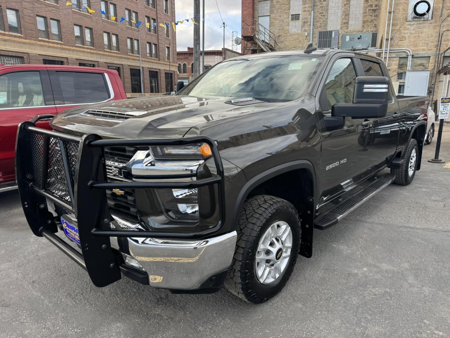 2022 Green /Grey Chevrolet Silverado 2500HD LT Crew Cab Standard Box 4WD (1GC4YNEY1NF) with an 6.6L V8 OHV 16V DIESEL engine, 6A transmission, located at 116 5th Avenue South, Lewistown, MT, 59457, 47.063877, -109.427879 - This 2022 Chevrolet Silverado 2500HD Crew Cab LT is built to work hard and ride right. Powered by the legendary Duramax diesel, it delivers serious towing capability with the smooth, confident pull diesel owners swear by. The Crew Cab gives you plenty of room for passengers, while the leather interi - Photo#0