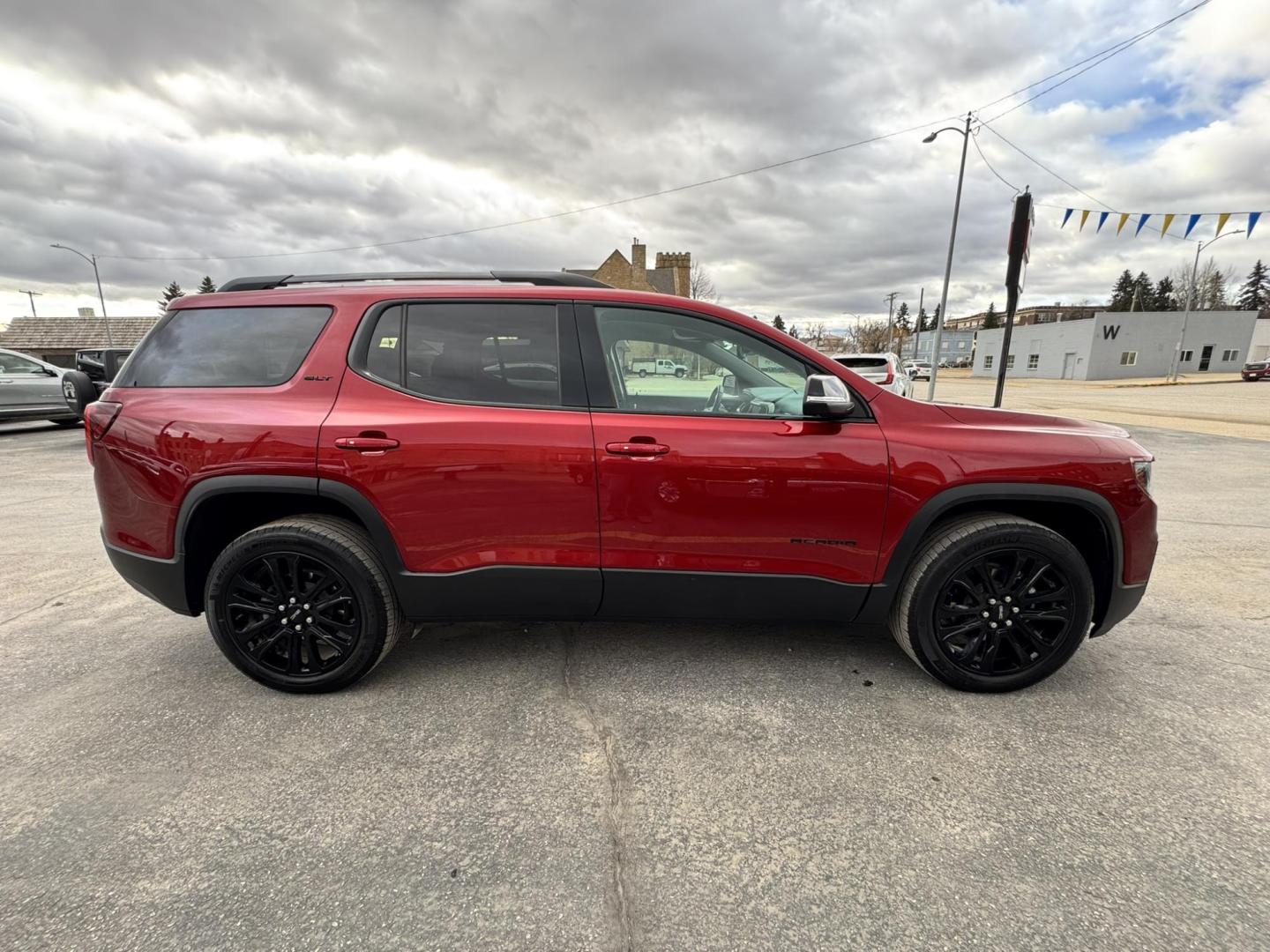 2023 Maroon /Black GMC Acadia SLT AWD (1GKKNULS7PZ) with an 3.6L V6 DOHC 24V engine, 9A transmission, located at 116 5th Avenue South, Lewistown, MT, 59457, 47.063877, -109.427879 - 2023 GMC Acadia SLT AWD Elevation Edition – sharp, loaded, and ready for anything. Finished with the Elevation Edition, this Acadia stands out with blacked-out wheels, trim, and badging that give it a bold, aggressive look you don’t see on every SUV. Powered by a smooth and capable V6 with all- - Photo#1