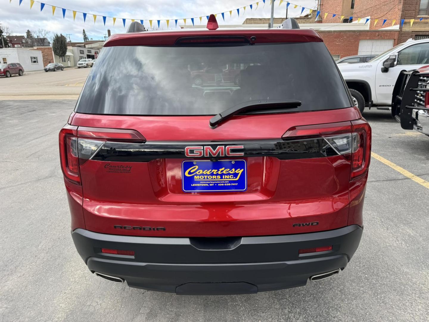 2023 Maroon /Black GMC Acadia SLT AWD (1GKKNULS7PZ) with an 3.6L V6 DOHC 24V engine, 9A transmission, located at 116 5th Avenue South, Lewistown, MT, 59457, 47.063877, -109.427879 - 2023 GMC Acadia SLT AWD Elevation Edition – sharp, loaded, and ready for anything. Finished with the Elevation Edition, this Acadia stands out with blacked-out wheels, trim, and badging that give it a bold, aggressive look you don’t see on every SUV. Powered by a smooth and capable V6 with all- - Photo#3