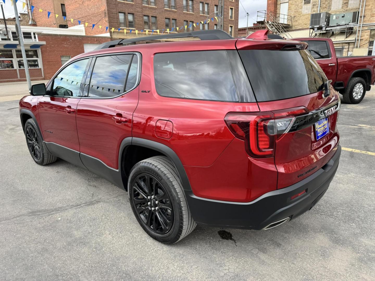 2023 Maroon /Black GMC Acadia SLT AWD (1GKKNULS7PZ) with an 3.6L V6 DOHC 24V engine, 9A transmission, located at 116 5th Avenue South, Lewistown, MT, 59457, 47.063877, -109.427879 - 2023 GMC Acadia SLT AWD Elevation Edition – sharp, loaded, and ready for anything. Finished with the Elevation Edition, this Acadia stands out with blacked-out wheels, trim, and badging that give it a bold, aggressive look you don’t see on every SUV. Powered by a smooth and capable V6 with all- - Photo#4