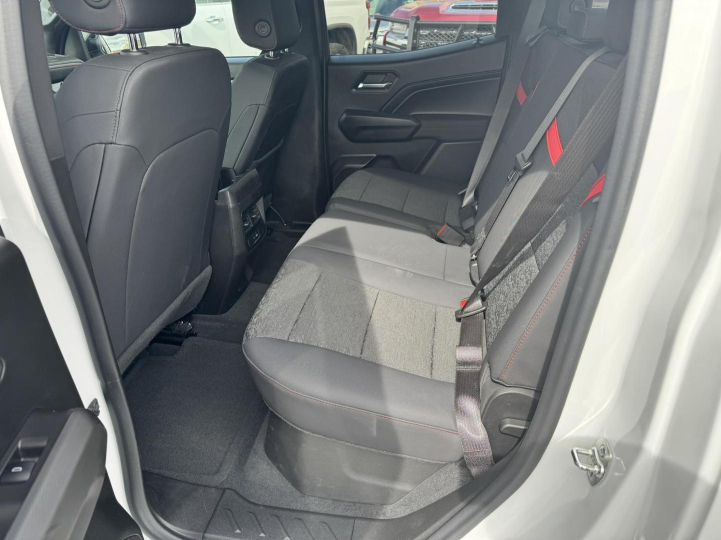 2024 WHITE /Black Chevrolet Colorado Z71 Crew Cab 4WD (1GCPTDEKXR1) with an 2.7L L4 DOHC 16V TURBO engine, 6A transmission, located at 116 5th Avenue South, Lewistown, MT, 59457, 47.063877, -109.427879 - Tough, refined, and built to handle whatever you throw at it—this 2024 Chevrolet Colorado Z71 4WD is the perfect blend of off-road capability and everyday comfort. Powered by a strong turbocharged engine with impressive torque, it delivers confident acceleration, smooth towing capability, and the - Photo#10