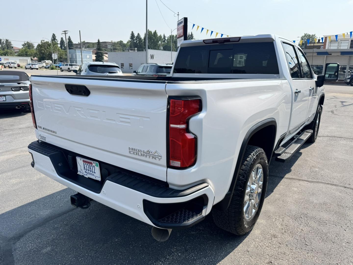 2025 WHITE /Tan Chevrolet Silverado 3500HD High Country Crew Cab 4WD (1GC4KVEY3SF) with an 6.6L V8 OHV 32V TURBO DIESEL engine, 6A transmission, located at 116 5th Avenue South, Lewistown, MT, 59457, 47.063877, -109.427879 - When only the best will do, this 2025 Chevrolet Silverado 3500HD High Country Crew Cab 4WD with the Duramax Turbo-Diesel delivers. Built for serious towing, hauling, and long days on the road, this heavy-duty pickup combines premium luxury with incredible capability, making it equally at home on the- Photo#2