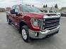 2023 Maroon /Tan GMC Sierra 2500HD SLT Crew Cab 2WD (1GT49NEY6PF) with an 6.6L V8 OHV 16V TURBO DIESEL engine, 6A transmission, located at 116 5th Avenue South, Lewistown, MT, 59457, 47.063877, -109.427879 - When it's time to get serious about towing, hauling, or simply driving one of the nicest heavy-duty trucks on the road, this 2023 GMC Sierra 2500HD SLT Crew Cab 4x4 is ready for the job. Powered by the legendary 6.6L Duramax Turbo-Diesel V8 paired with the Allison® 10-speed automatic transmission,- Photo#0