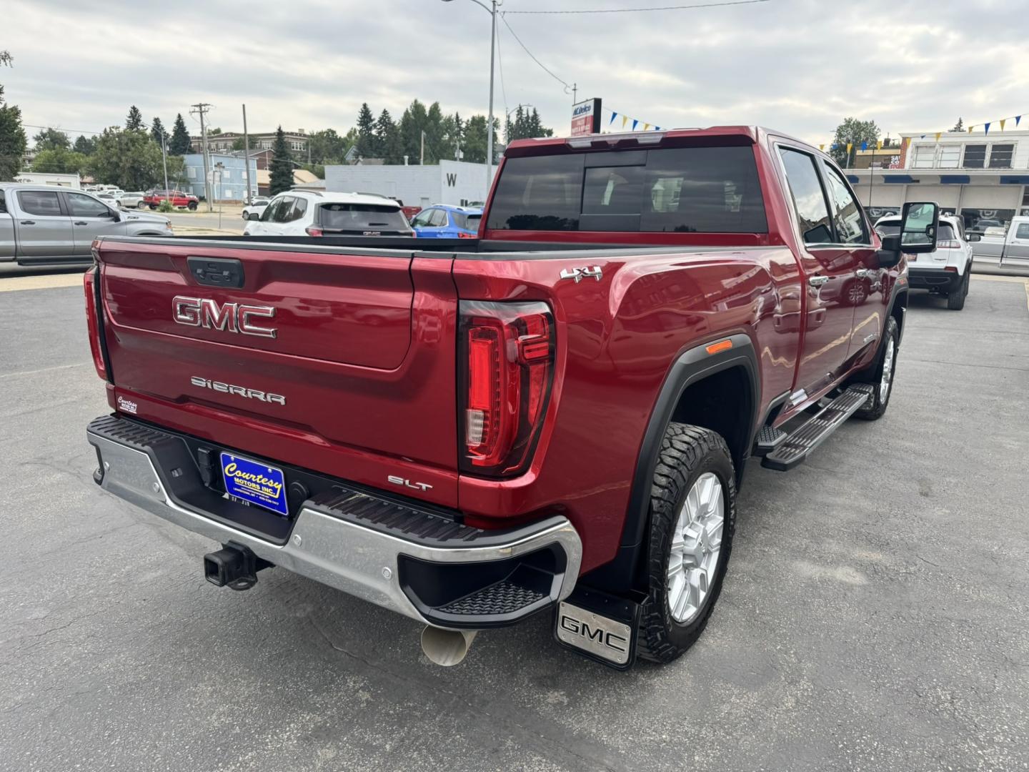 2023 Maroon /Tan GMC Sierra 2500HD SLT Crew Cab 2WD (1GT49NEY6PF) with an 6.6L V8 OHV 16V TURBO DIESEL engine, 6A transmission, located at 116 5th Avenue South, Lewistown, MT, 59457, 47.063877, -109.427879 - When it's time to get serious about towing, hauling, or simply driving one of the nicest heavy-duty trucks on the road, this 2023 GMC Sierra 2500HD SLT Crew Cab 4x4 is ready for the job. Powered by the legendary 6.6L Duramax Turbo-Diesel V8 paired with the Allison® 10-speed automatic transmission,- Photo#2
