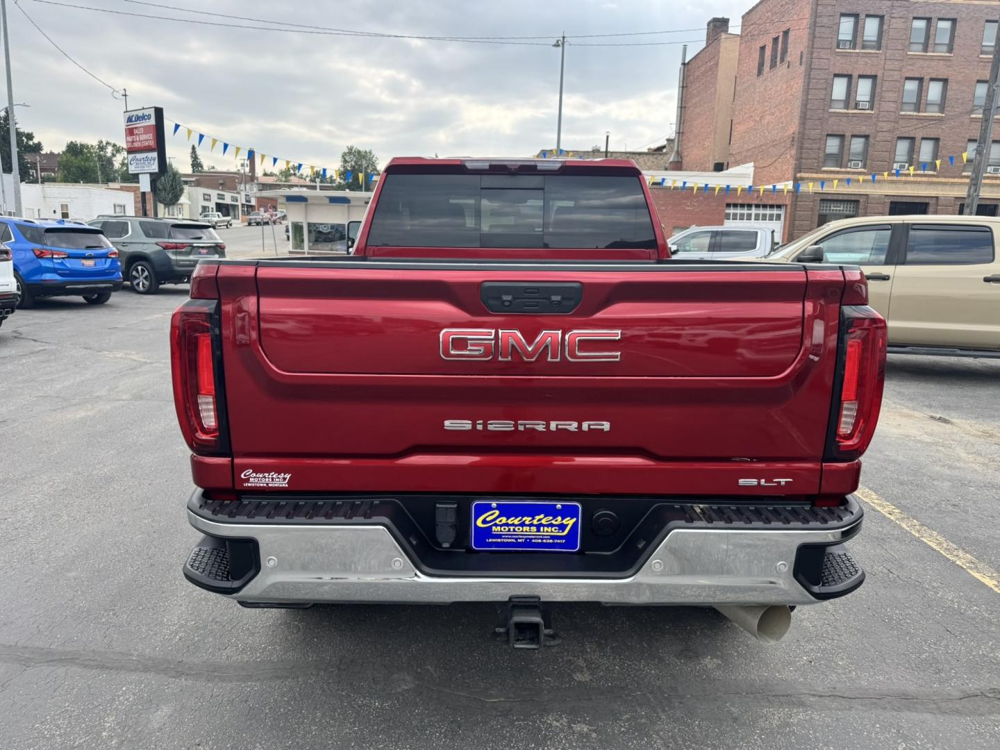2023 Maroon /Tan GMC Sierra 2500HD SLT Crew Cab 2WD (1GT49NEY6PF) with an 6.6L V8 OHV 16V TURBO DIESEL engine, 6A transmission, located at 116 5th Avenue South, Lewistown, MT, 59457, 47.063877, -109.427879 - When it's time to get serious about towing, hauling, or simply driving one of the nicest heavy-duty trucks on the road, this 2023 GMC Sierra 2500HD SLT Crew Cab 4x4 is ready for the job. Powered by the legendary 6.6L Duramax Turbo-Diesel V8 paired with the Allison® 10-speed automatic transmission,- Photo#3
