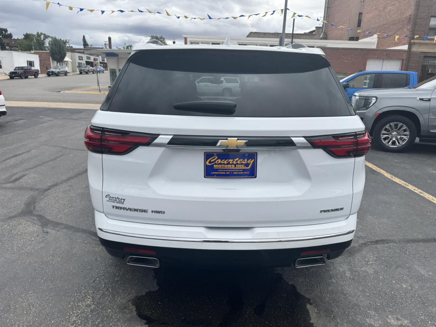 2023 WHITE /Black Chevrolet Traverse Premier AWD (1GNEVKKW9PJ) with an 3.6L V6 DOHC 24V engine, 9A transmission, located at 116 5th Avenue South, Lewistown, MT, 59457, 47.063877, -109.427879 - This 2023 Chevrolet Traverse Premier AWD gives you the perfect combination of luxury, space and all-weather capability. Powered by the proven 3.6L V6 with 310 horsepower and paired with a 9-speed automatic transmission, the Traverse has plenty of power while the AWD system gives you added confidence- Photo#3