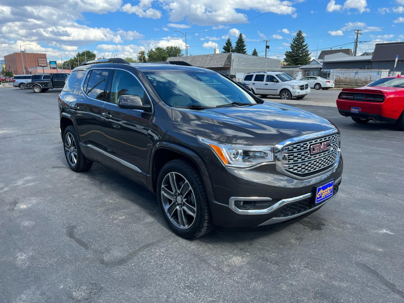 2019 Bronze Metallic /Tan GMC Acadia Denali AWD (1GKKNXLS9KZ) with an 3.6L V6 DOHC 24V engine, 6A transmission, located at 116 5th Avenue South, Lewistown, MT, 59457, 47.063877, -109.427879 - Clean Car Fax on this 2019 GMC Acadia Denali AWD! Loaded with navigation, heated and ventilated memory leather seats, rear heated seats, DRIVER ALERT PACKAGE II: * SAFETY ALERT SEAT * HEADLAMPS, INTELLIBEAM, AUTOMATIC HIGH-BEAM * FRONT & REAR PARK ASSIST * FOLLOWING DISTANCE INDICATOR * FORWARD COL - Photo #0