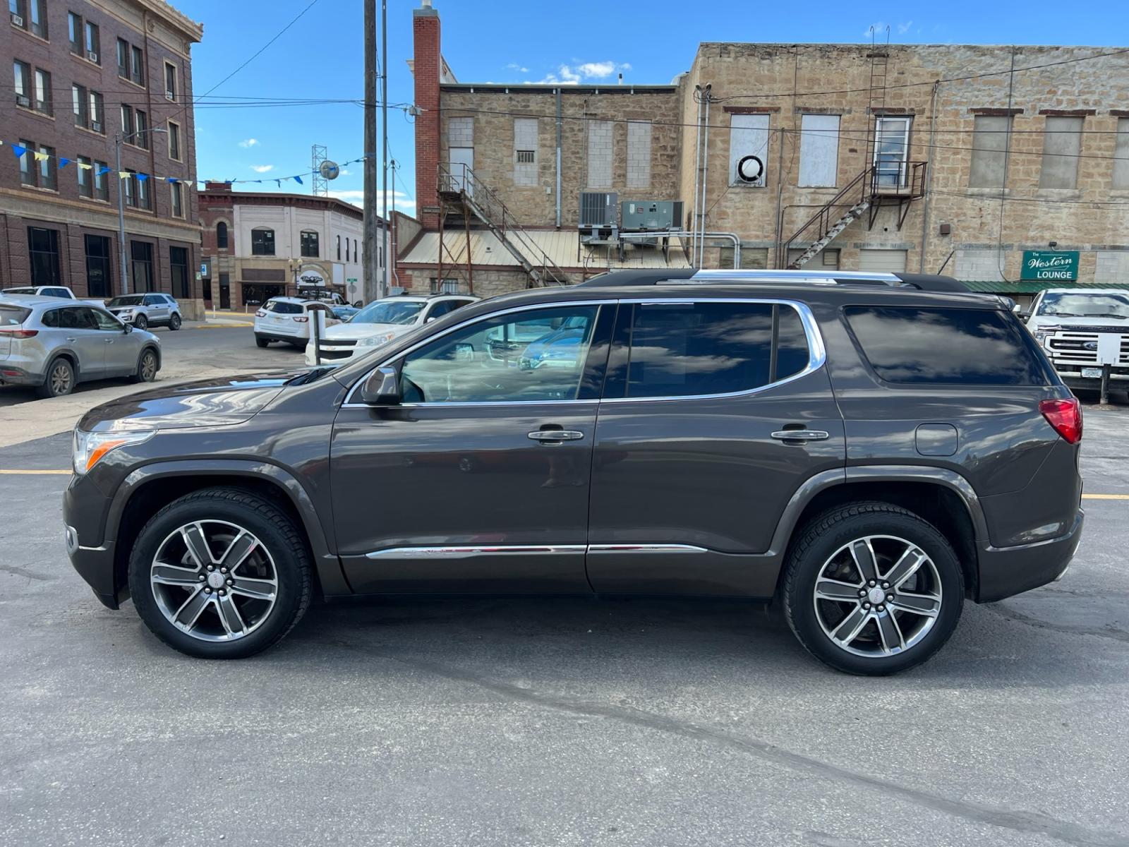 2019 Bronze Metallic /Tan GMC Acadia Denali AWD (1GKKNXLS9KZ) with an 3.6L V6 DOHC 24V engine, 6A transmission, located at 116 5th Avenue South, Lewistown, MT, 59457, 47.063877, -109.427879 - Clean Car Fax on this 2019 GMC Acadia Denali AWD! Loaded with navigation, heated and ventilated memory leather seats, rear heated seats, DRIVER ALERT PACKAGE II: * SAFETY ALERT SEAT * HEADLAMPS, INTELLIBEAM, AUTOMATIC HIGH-BEAM * FRONT & REAR PARK ASSIST * FOLLOWING DISTANCE INDICATOR * FORWARD COL - Photo #4