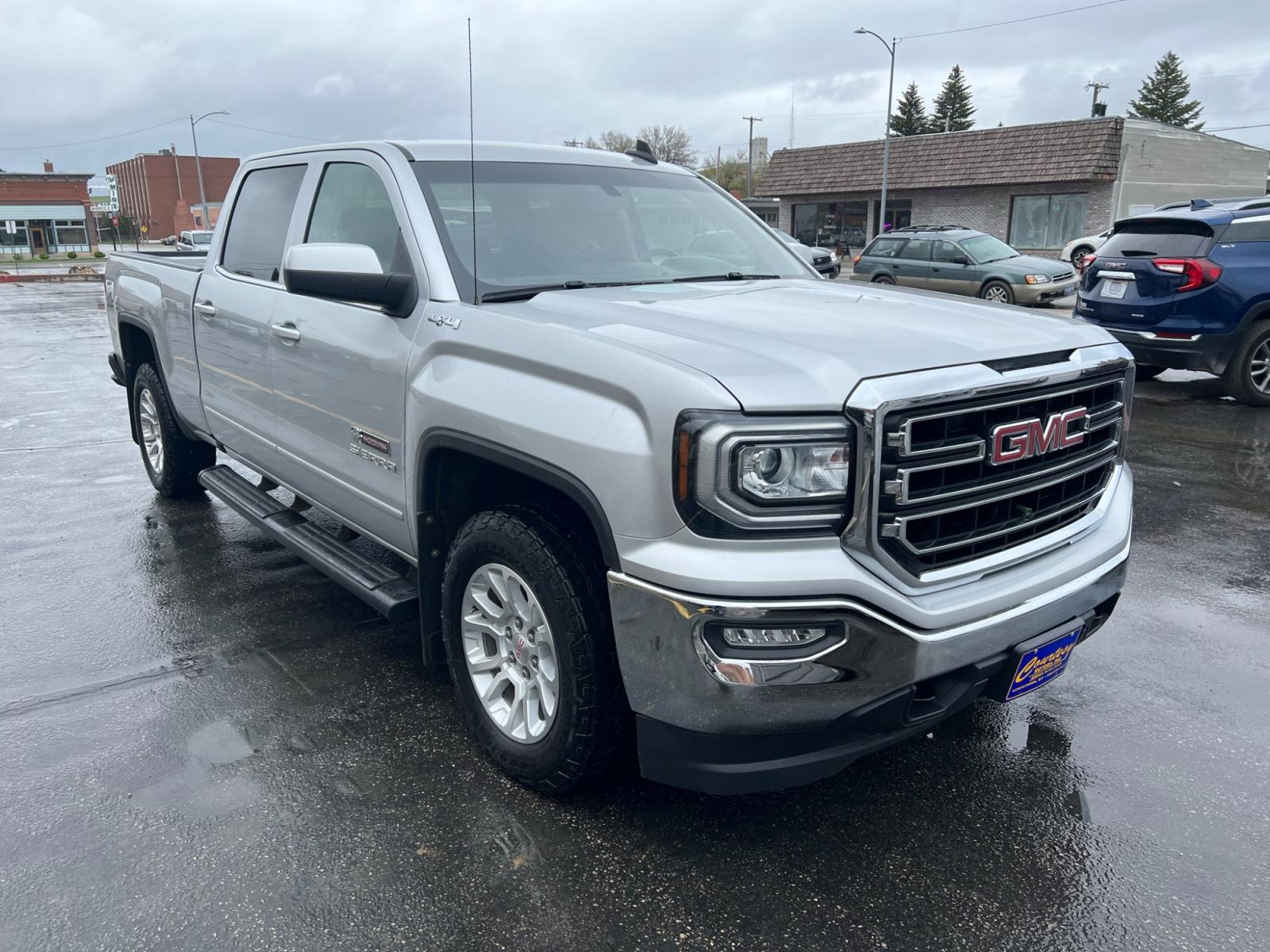 2017 SILVER /Ebony GMC Sierra 1500 SLE Crew Cab Standard Box 4WD (3GTU2MEC0HG) with an 5.3L V8 OHV 16V engine, 6A transmission, located at 116 5th Avenue South, Lewistown, MT, 59457, 47.063877, -109.427879 - Clean Car Fax on this 2017 GMC Sierra 1500 Crew Cab SLE! It's got the 6.5' box, trailer brake controller, locking differential, dual zone automatic climate control and more! The Sierra 1500 is a handsome machine, especially when decked out in the ultraluxurious Denali trim or the sinister-looking A - Photo #0