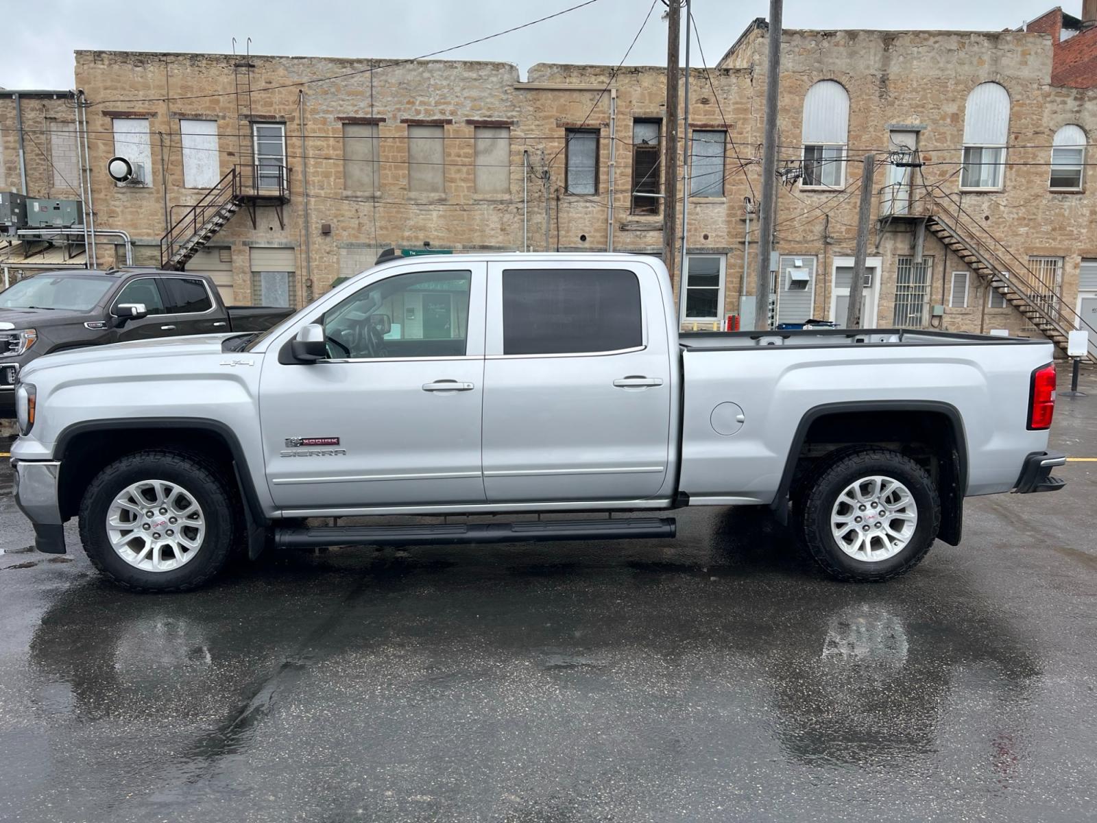 2017 SILVER /Ebony GMC Sierra 1500 SLE Crew Cab Standard Box 4WD (3GTU2MEC0HG) with an 5.3L V8 OHV 16V engine, 6A transmission, located at 116 5th Avenue South, Lewistown, MT, 59457, 47.063877, -109.427879 - Clean Car Fax on this 2017 GMC Sierra 1500 Crew Cab SLE! It's got the 6.5' box, trailer brake controller, locking differential, dual zone automatic climate control and more! The Sierra 1500 is a handsome machine, especially when decked out in the ultraluxurious Denali trim or the sinister-looking A - Photo #5